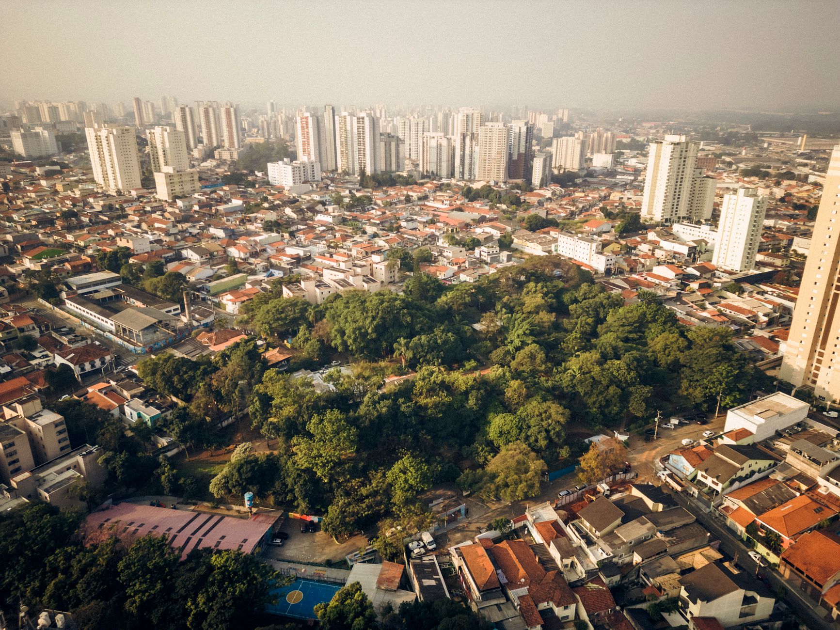 Captivating aerial view of Vila Endres in Sao Paulo, showcasing modern cityscape and green park areas.