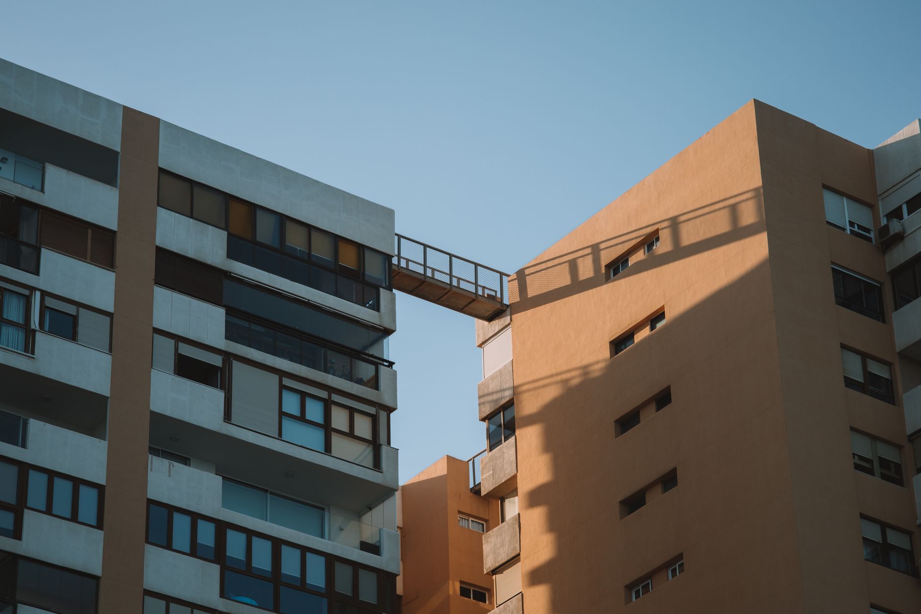 Architectural shot of contemporary residential buildings with bridge in Málaga, Spain.