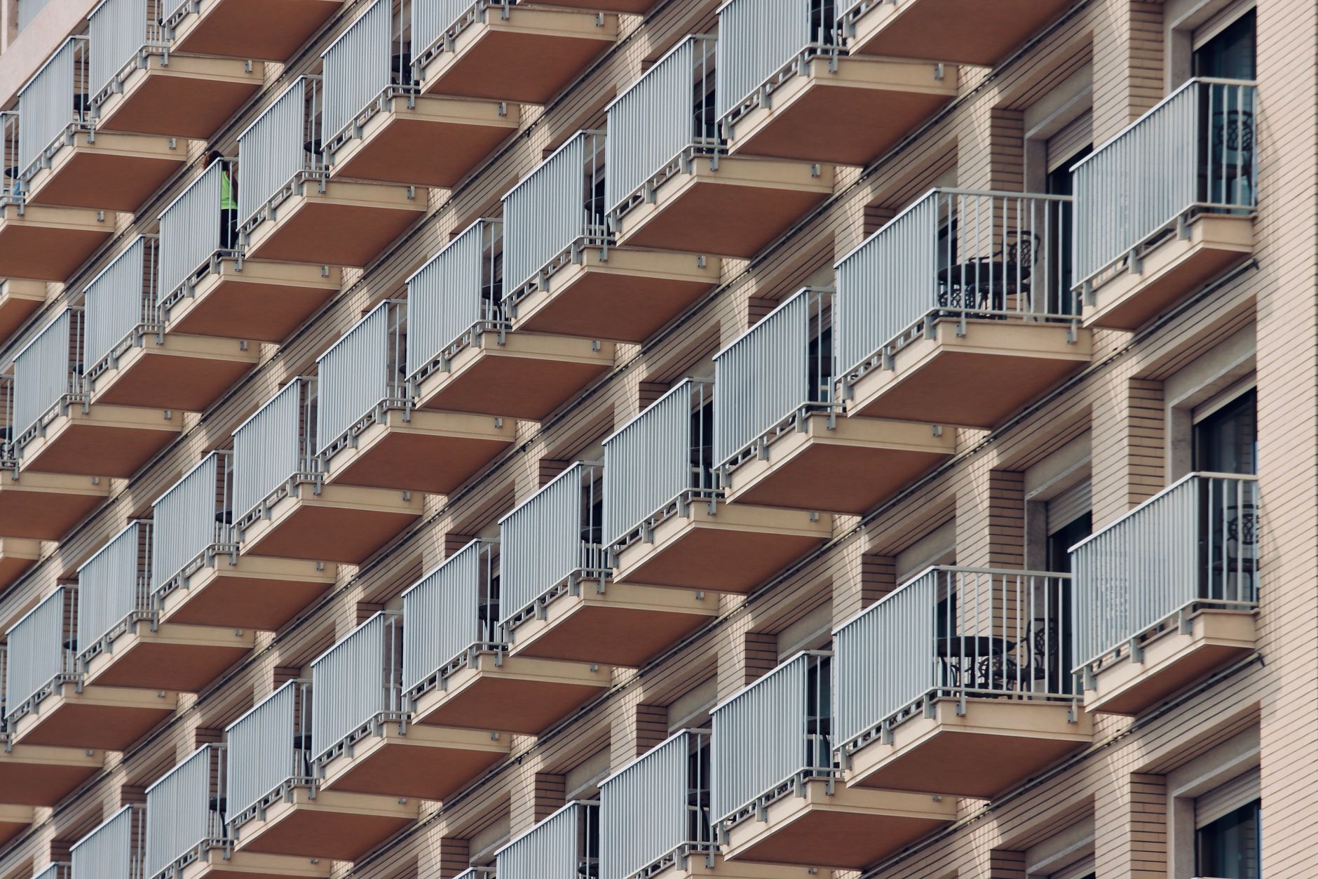 Patterned view of apartment balconies in Naples, highlighting urban architecture.
