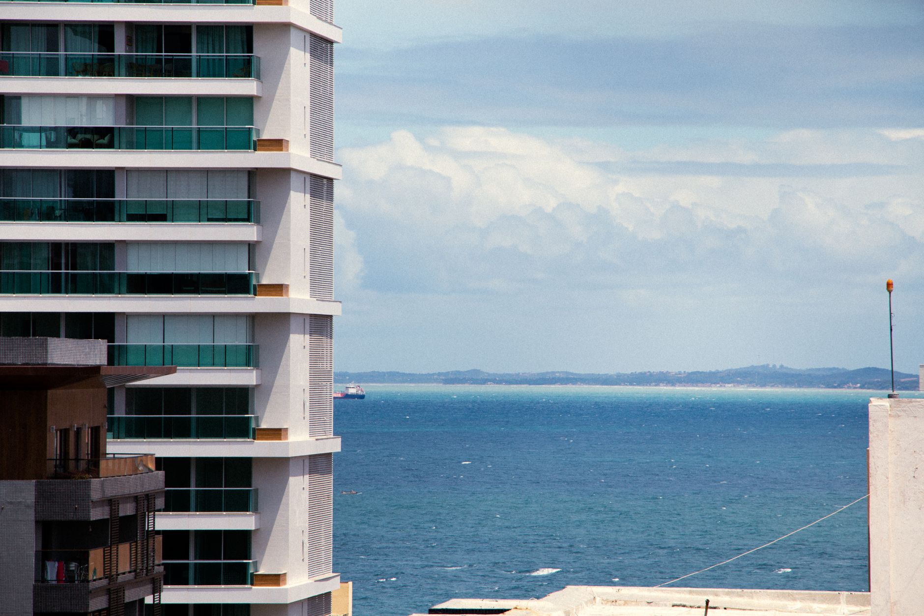 Modern high-rise building with ocean view in Salvador, Brazil. Perfect for travel and architecture enthusiasts.