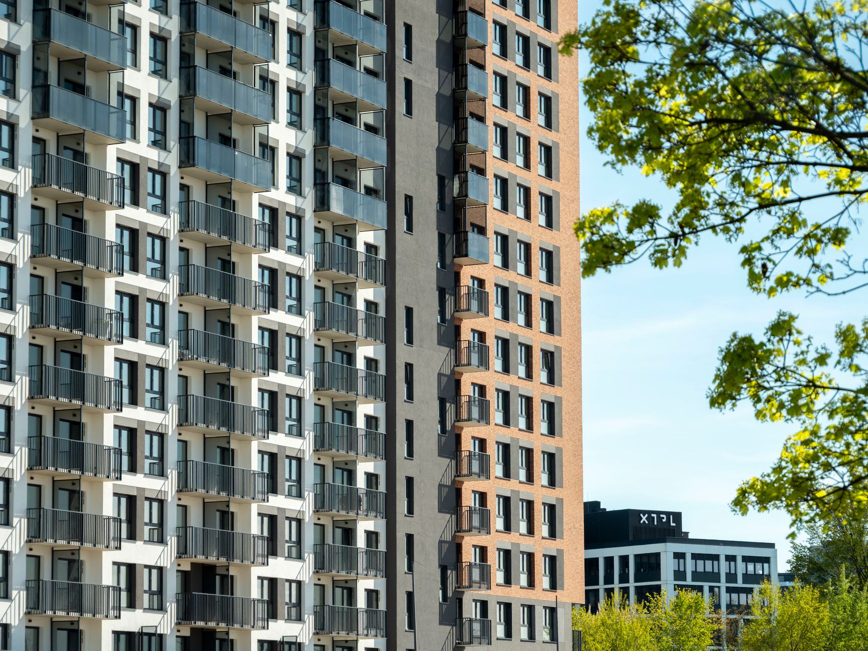 Contemporary architecture featuring high-rise apartment buildings in Wrocław, Poland.