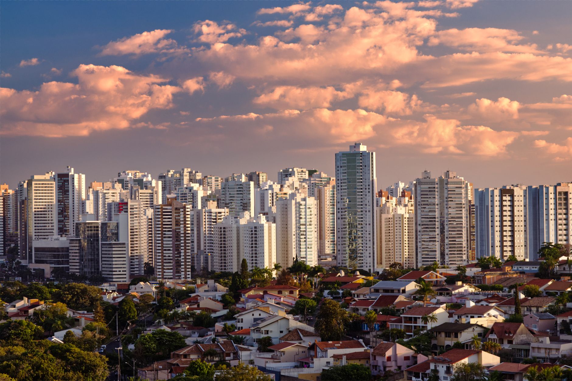 Captivating skyline of Londrina, Brazil with skyscrapers under a vibrant sunset sky.