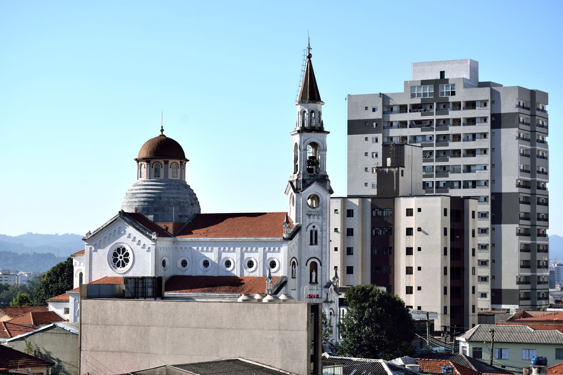 A beautiful church beside modern high-rise buildings in São Paulo, Brazil.