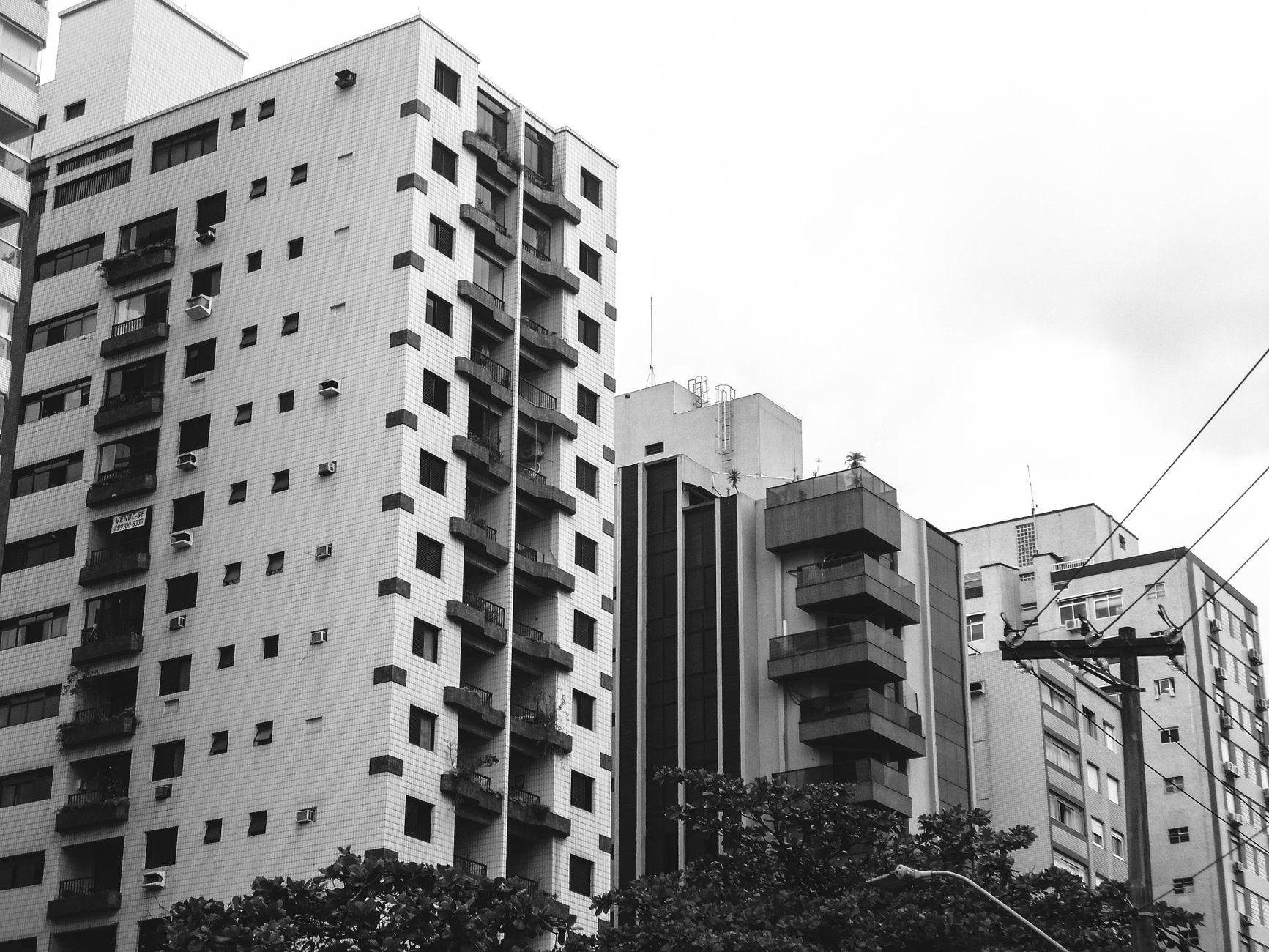 Monochrome view of residential buildings in a modern urban cityscape.