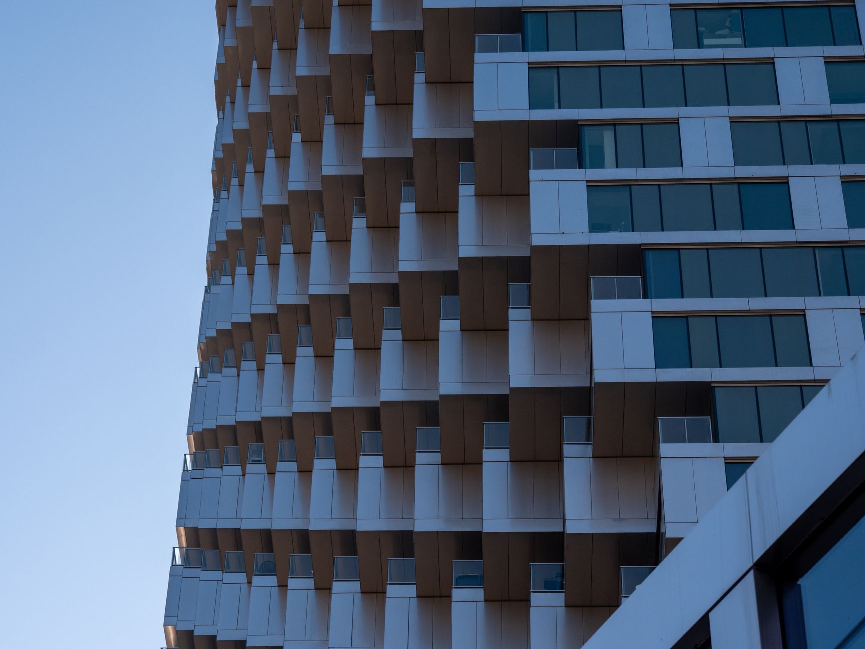 Explore the dynamic architecture of a modern high-rise building in Vancouver showcasing innovative design.