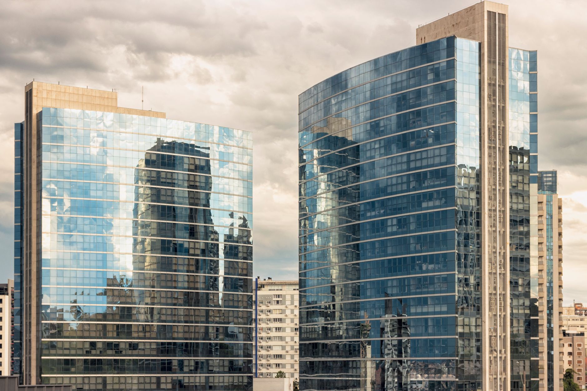 Stylish high-rise office buildings reflecting urban landscape in Porto Alegre, Brazil.