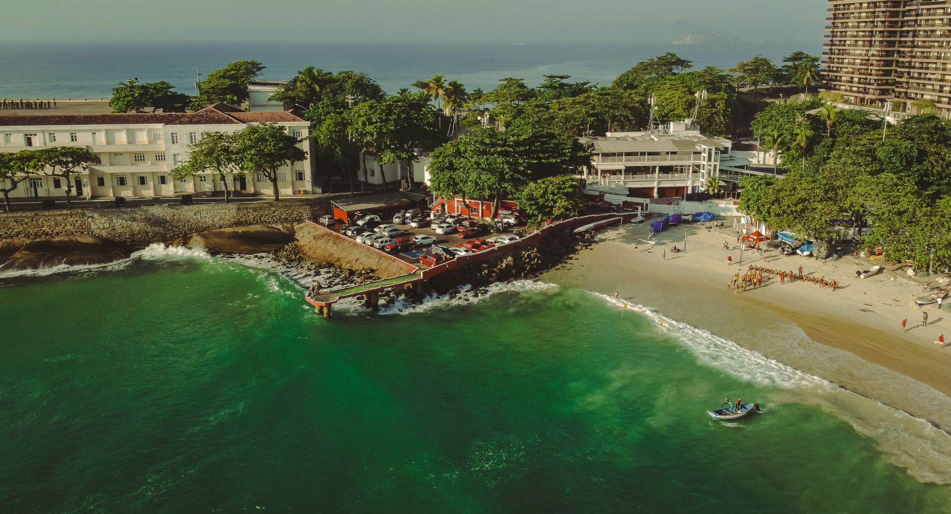 A stunning aerial view of Copacabana's coastline in Rio de Janeiro, showcasing the beach and lush greenery.