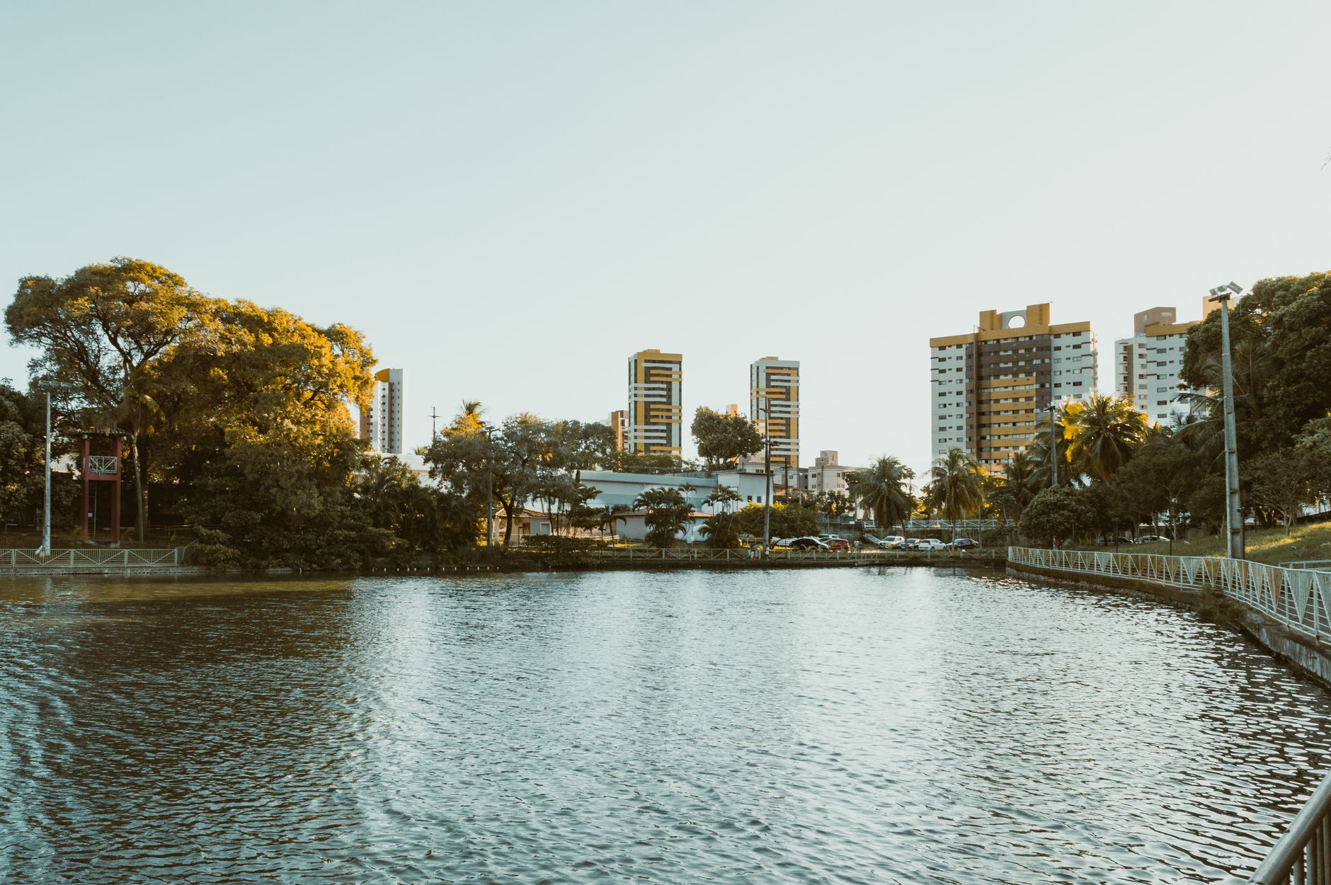 Scenic view of a waterfront with modern buildings in Natal, RN, Brazil during a sunny day.