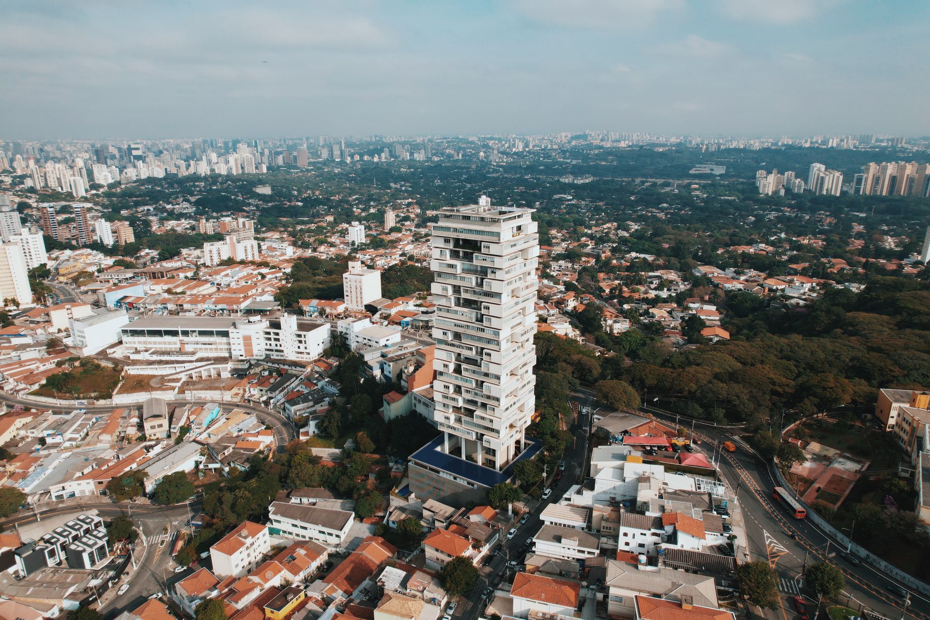 High-angle aerial shot of São Paulo showcasing urban architecture and greenery.