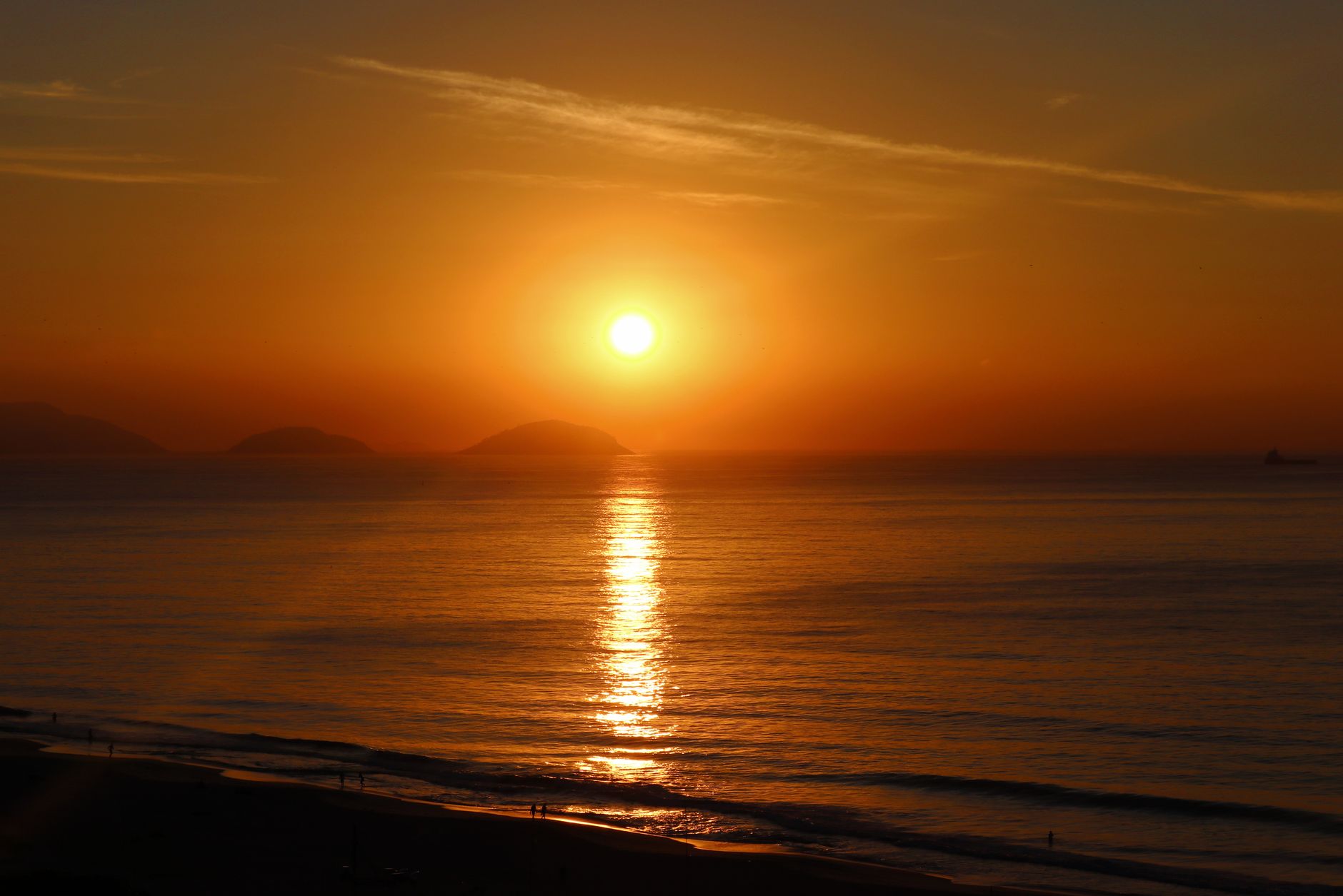 Stunning sunset over the Atlantic Ocean near Rio de Janeiro, capturing the vibrant colors and peaceful seascape.