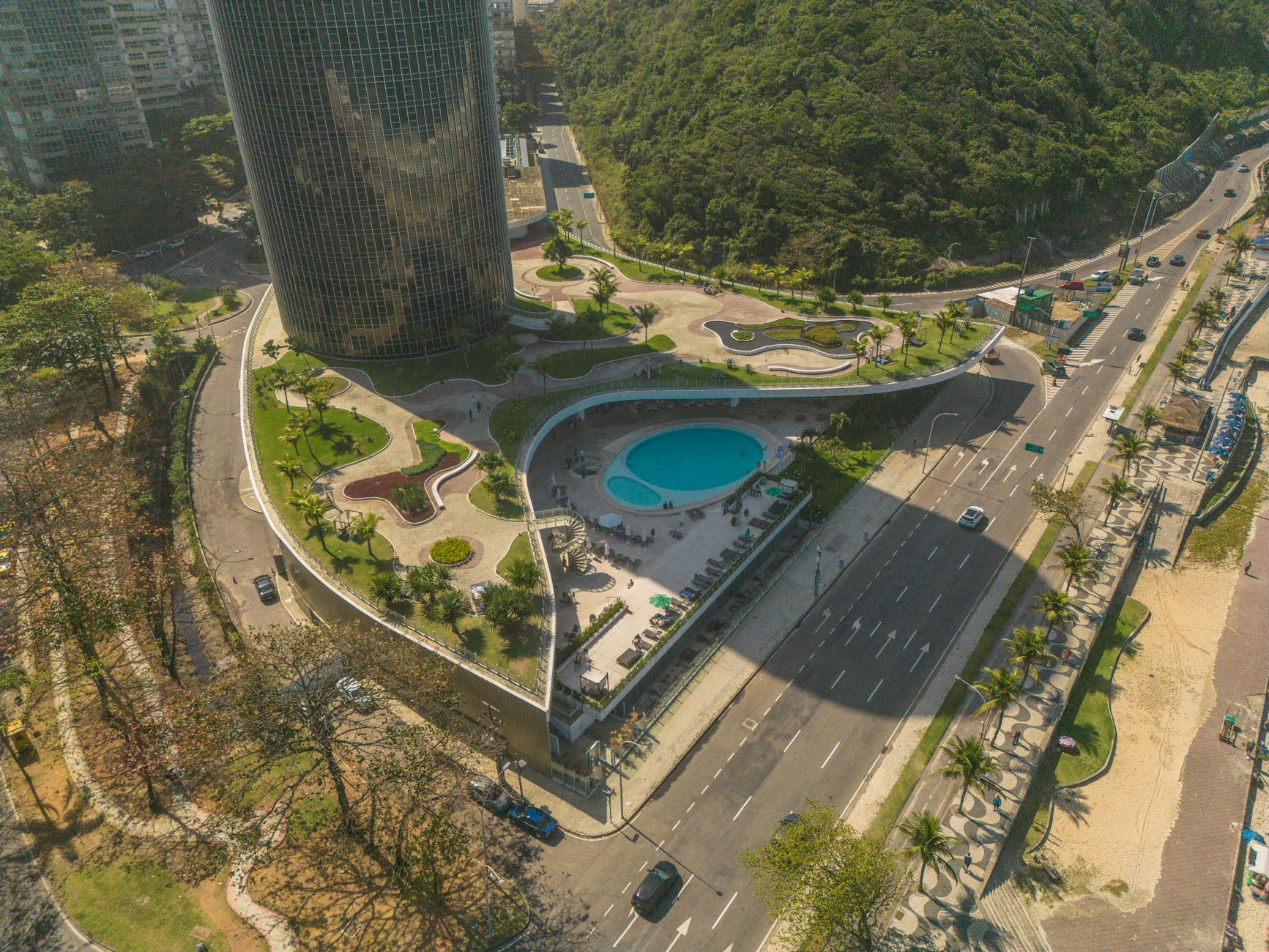 Aerial photograph of Rio de Janeiro featuring modern architecture and lush greenery.