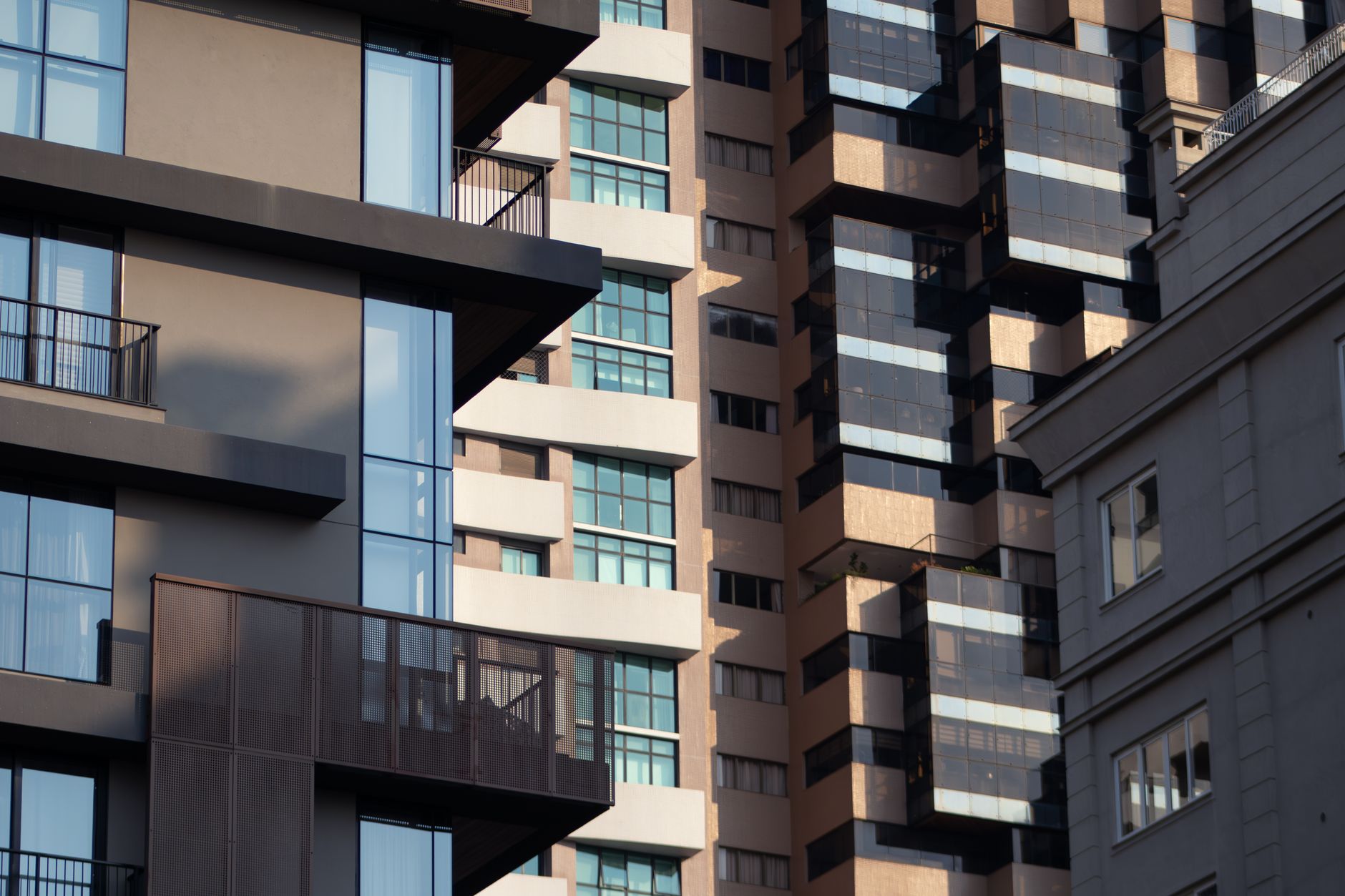 A dramatic view of modern urban architecture highlighting geometric patterns and contemporary design.