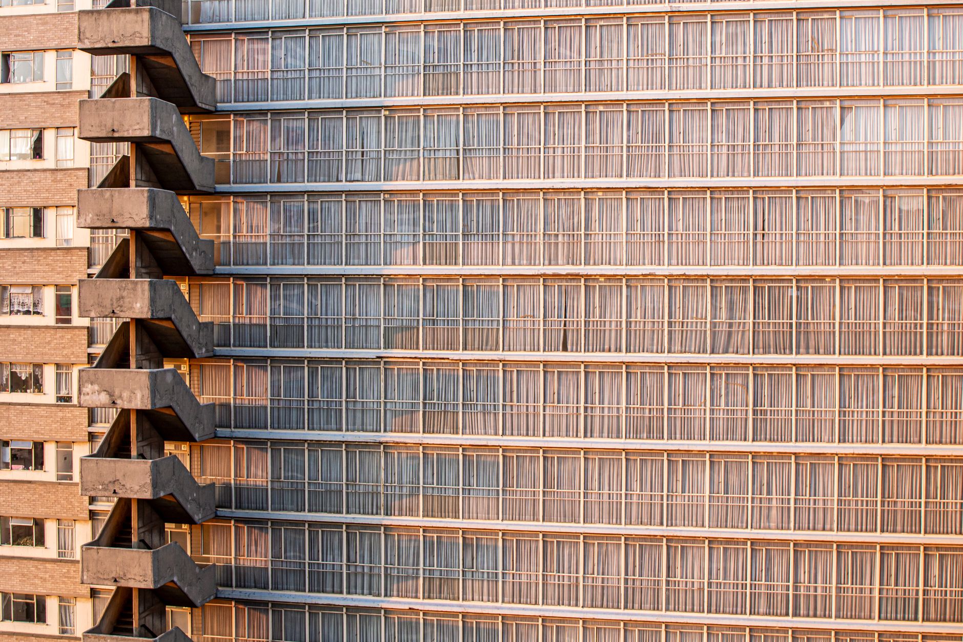 Architectural detail of a high-rise building with glass and concrete facade in Johannesburg.