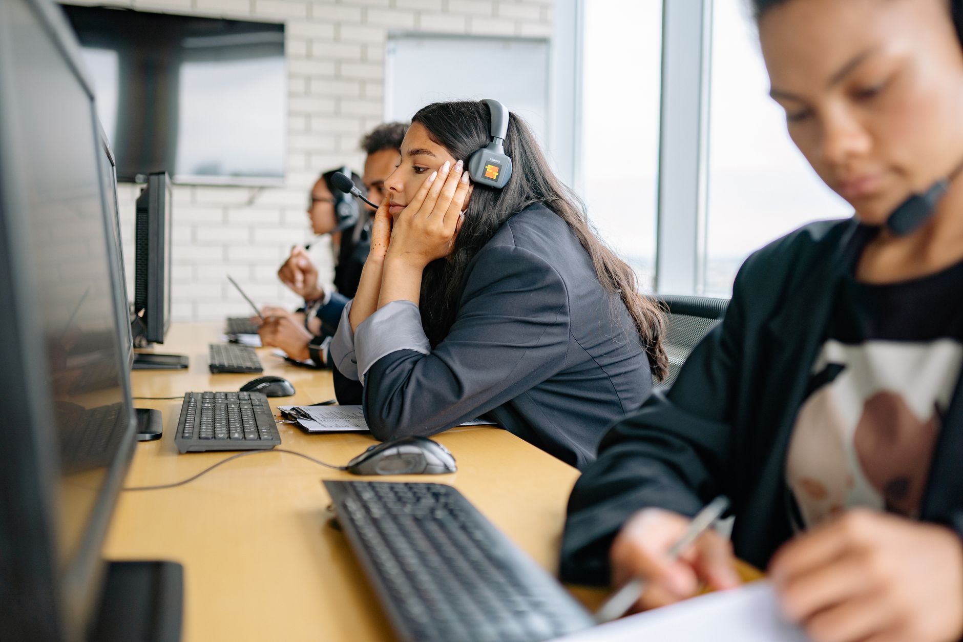 Professional call center team engaged in work at modern office.