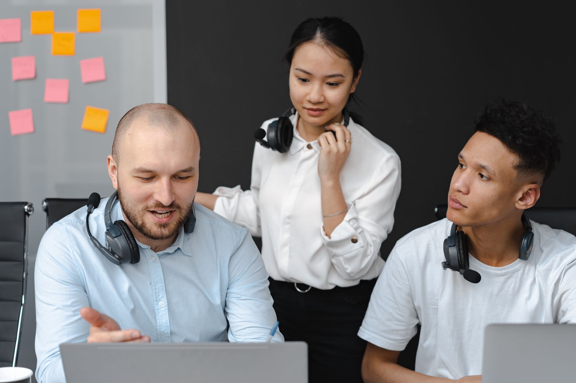 A diverse group of customer service representatives collaborating in a modern office setting.