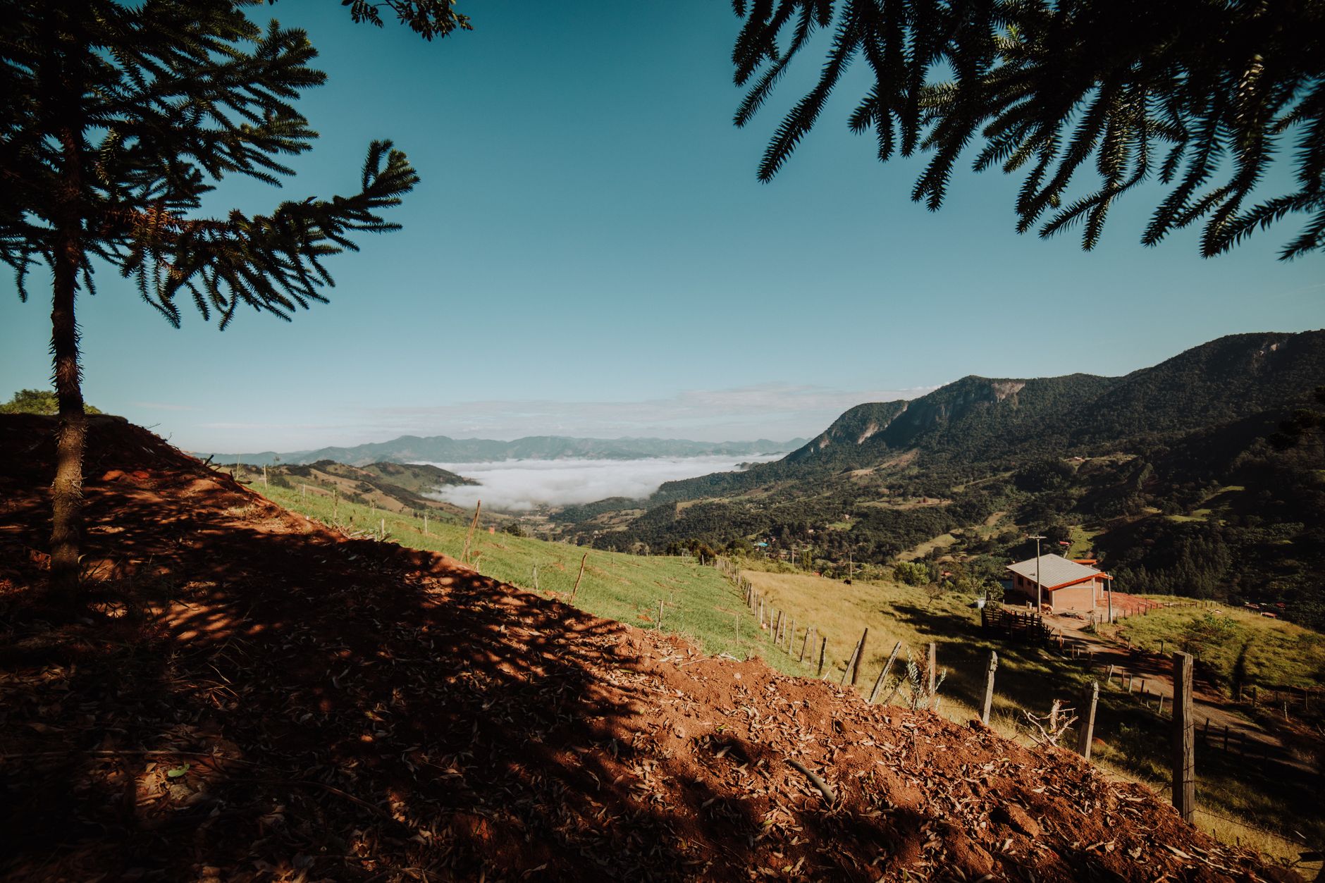 Stunning landscape of São Bento do Sapucaí in Brazil with hills and a distant view of clouds.