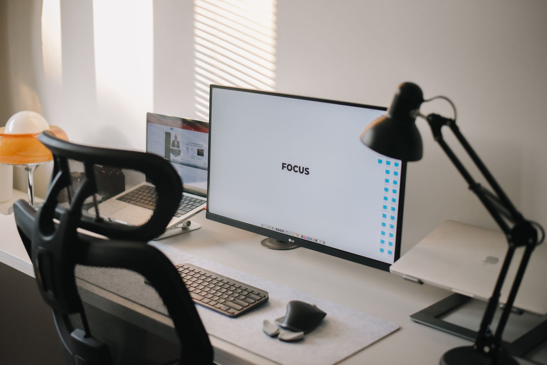 A clean and modern home office desk with a focus on productivity and technology.