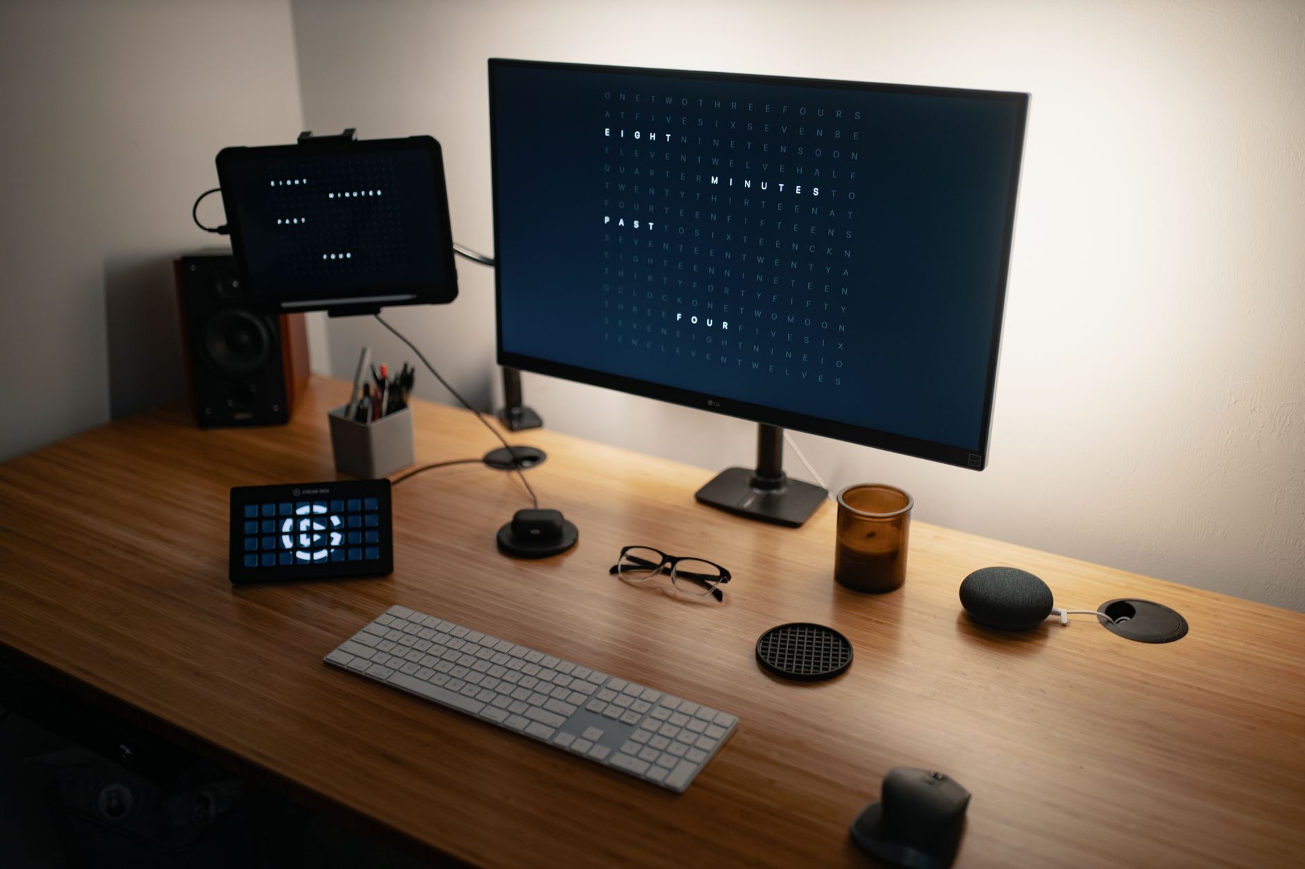 From above of flat screen computer and keyboard placed on wooden table with modern gadgets and monitors in workspace