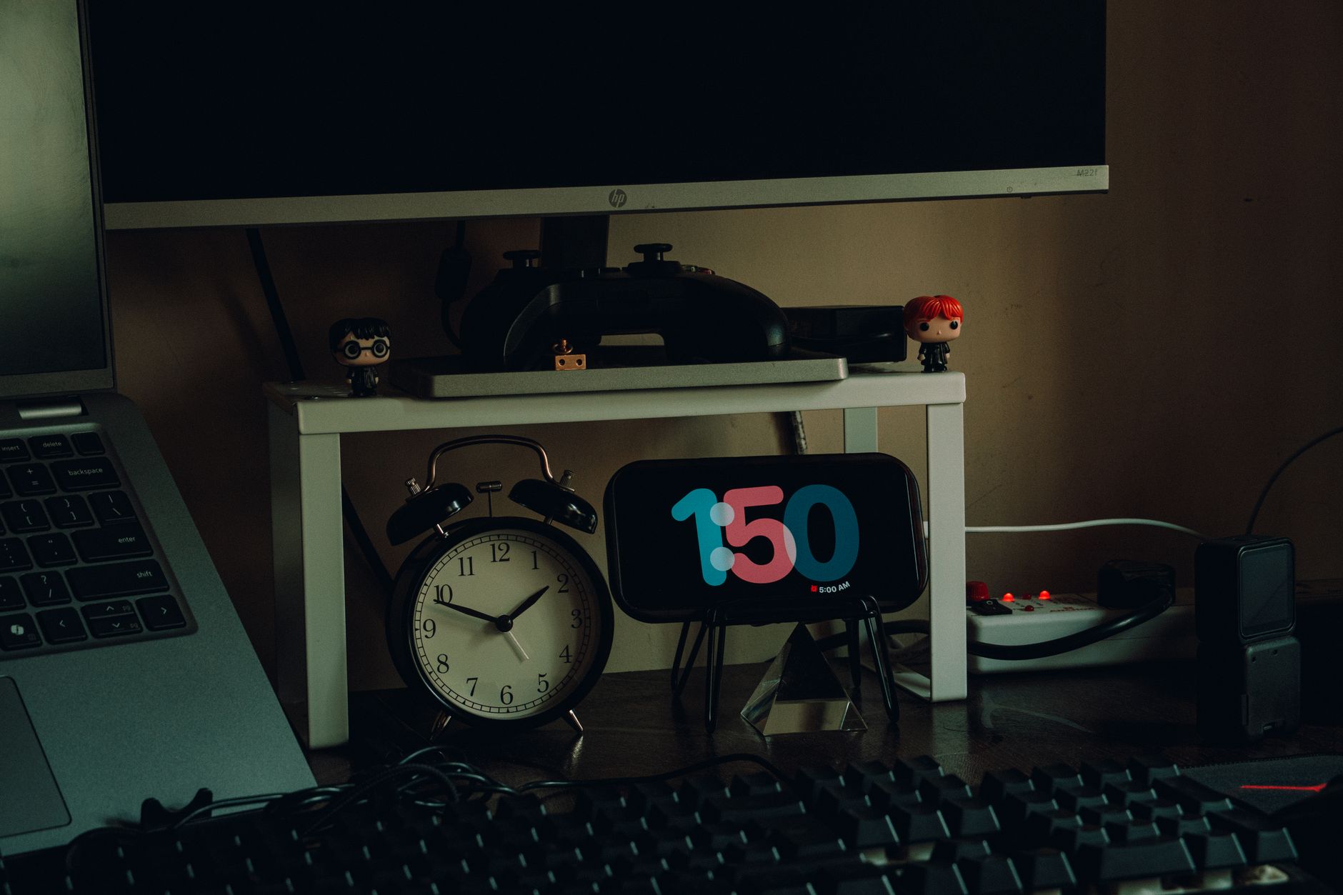 Organized home workspace featuring desk decor, clocks, and modern desk setup for productivity.