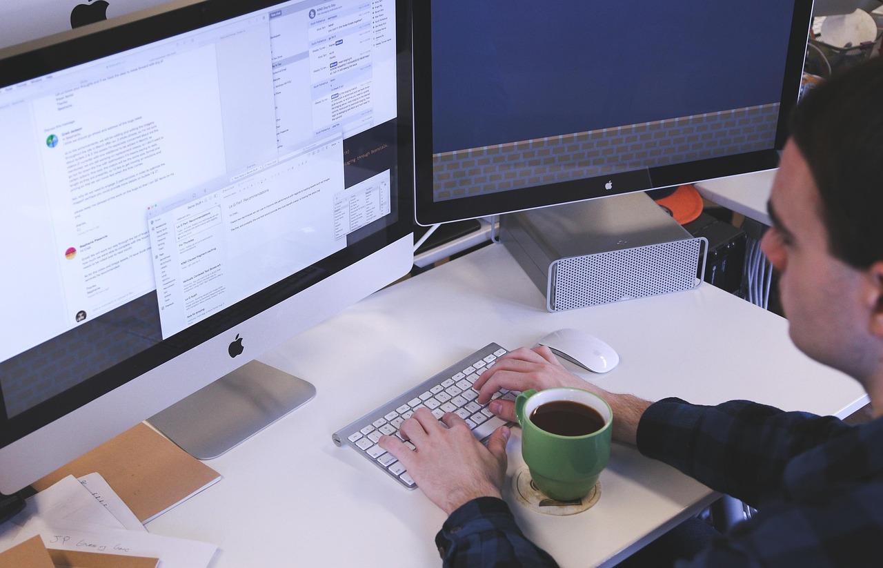 Professionals in a Virginia Beach office using a digital time management tool to coordinate tasks and deadlines