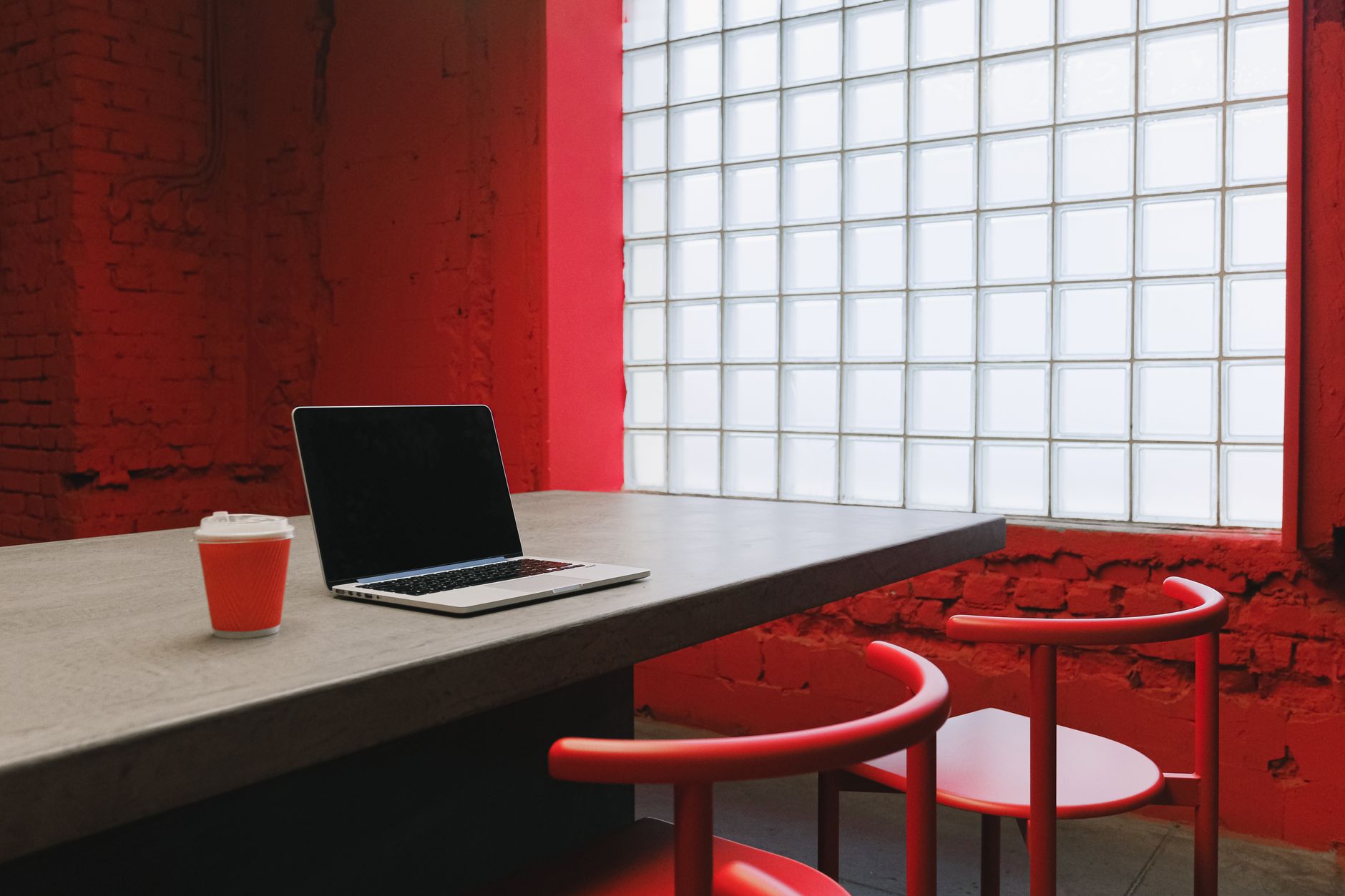 Modern office building in Phoenix with remote workers collaborating digitally