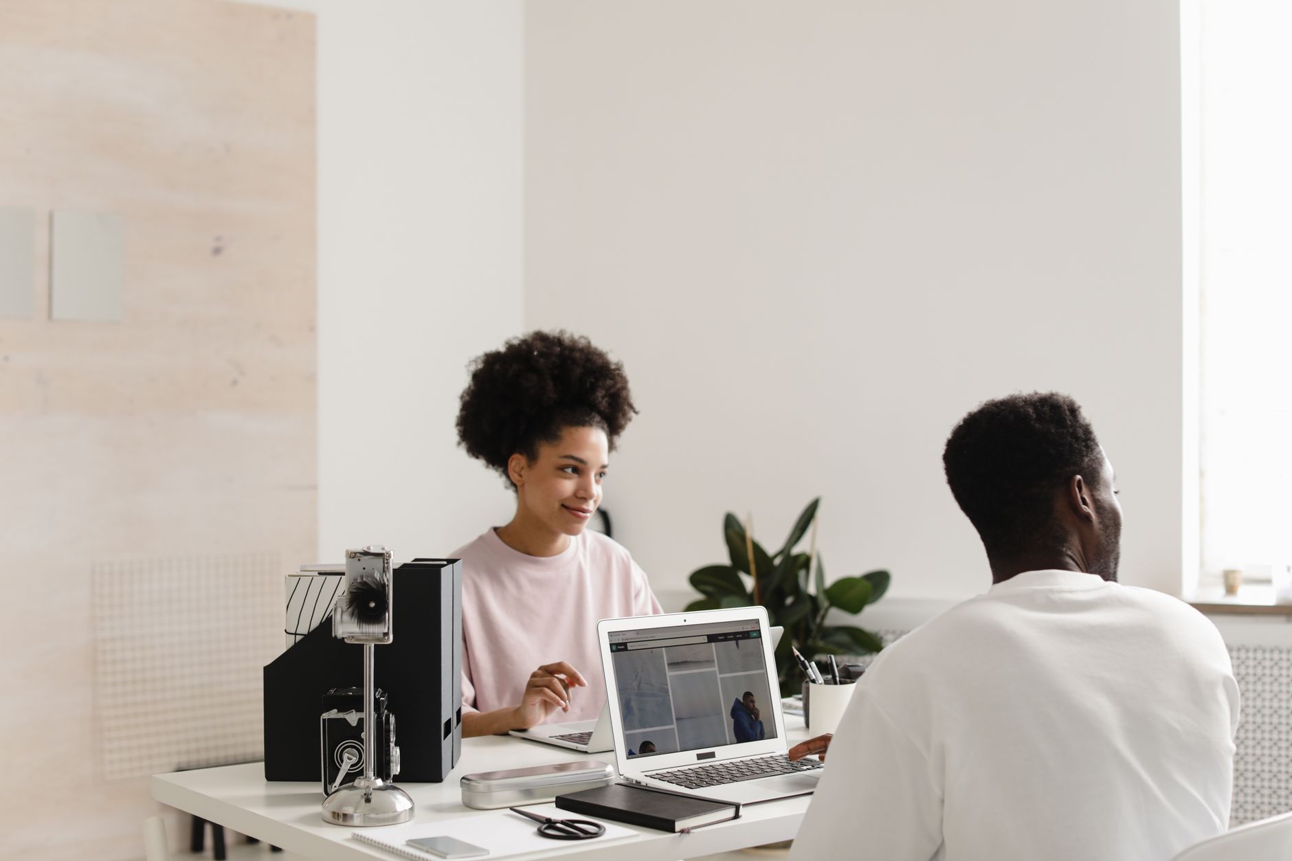 Diverse professional team collaborating in Philadelphia coworking space using task management software