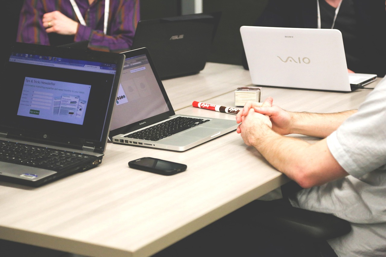 Professional using a laptop with a mountain view in Denver, demonstrating work-life balance