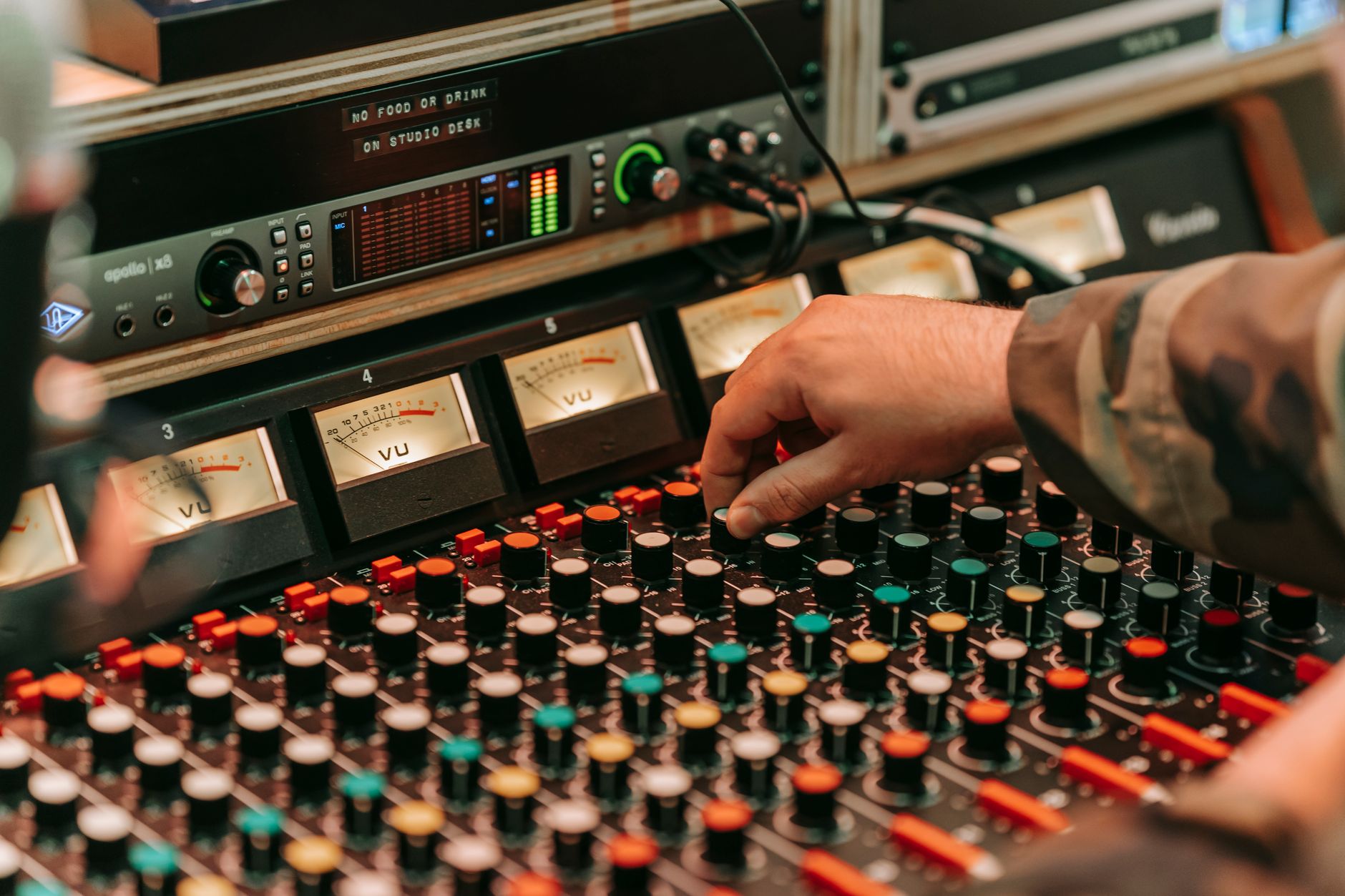 Nashville recording studio with musicians and task management software visible