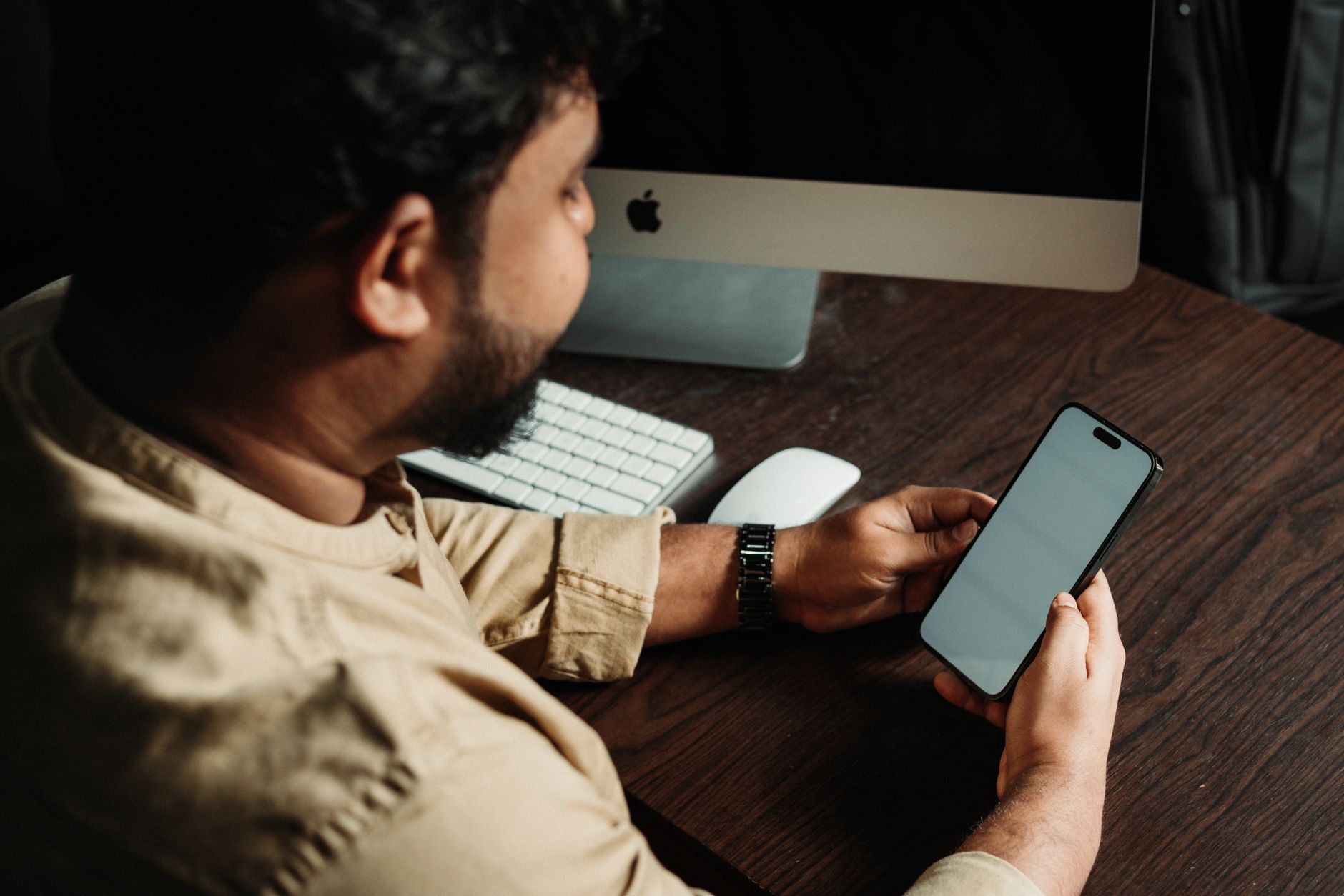 Person struggling with multiple task management apps on smartphone