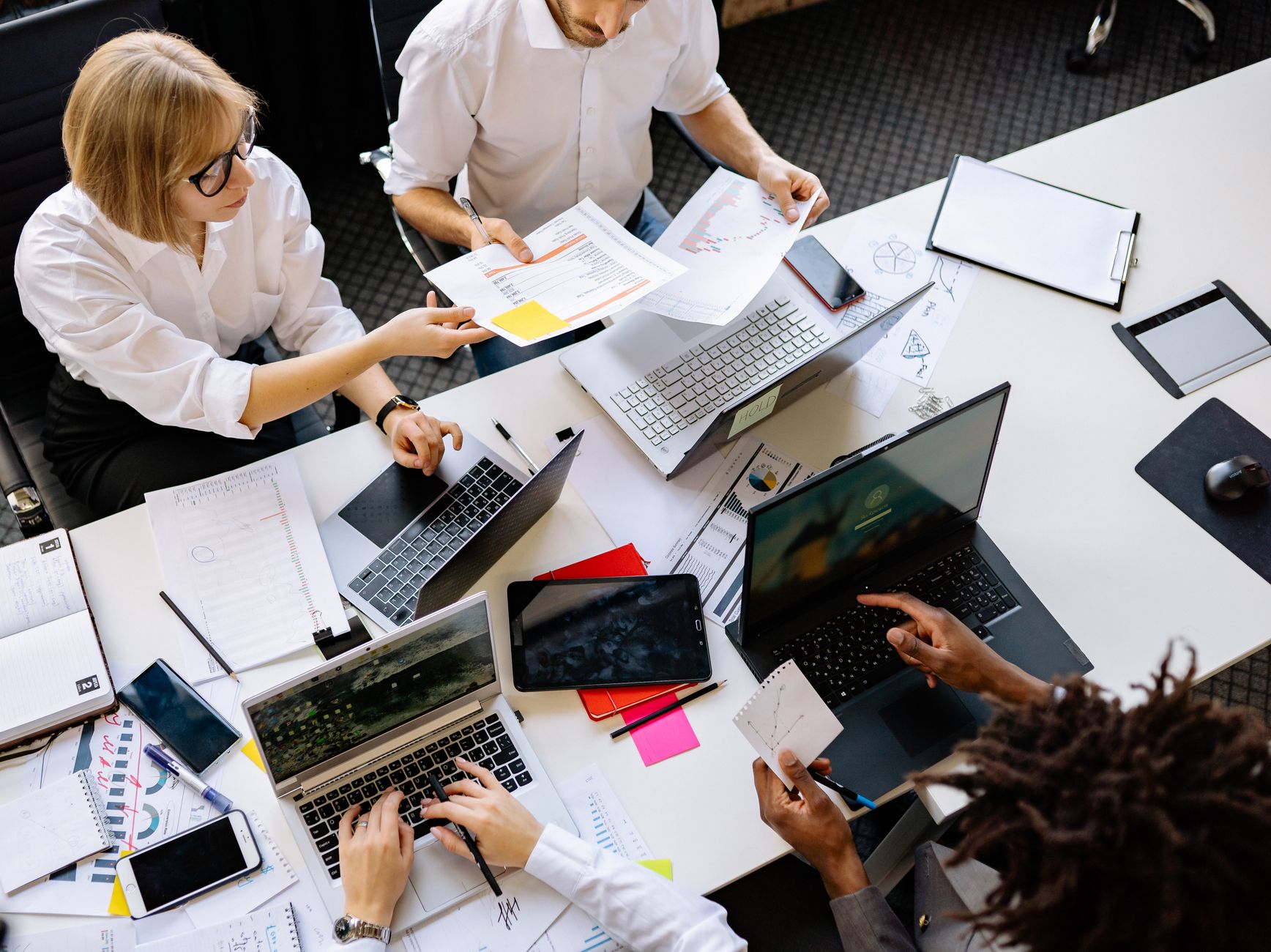 Diverse team reviewing productivity dashboard