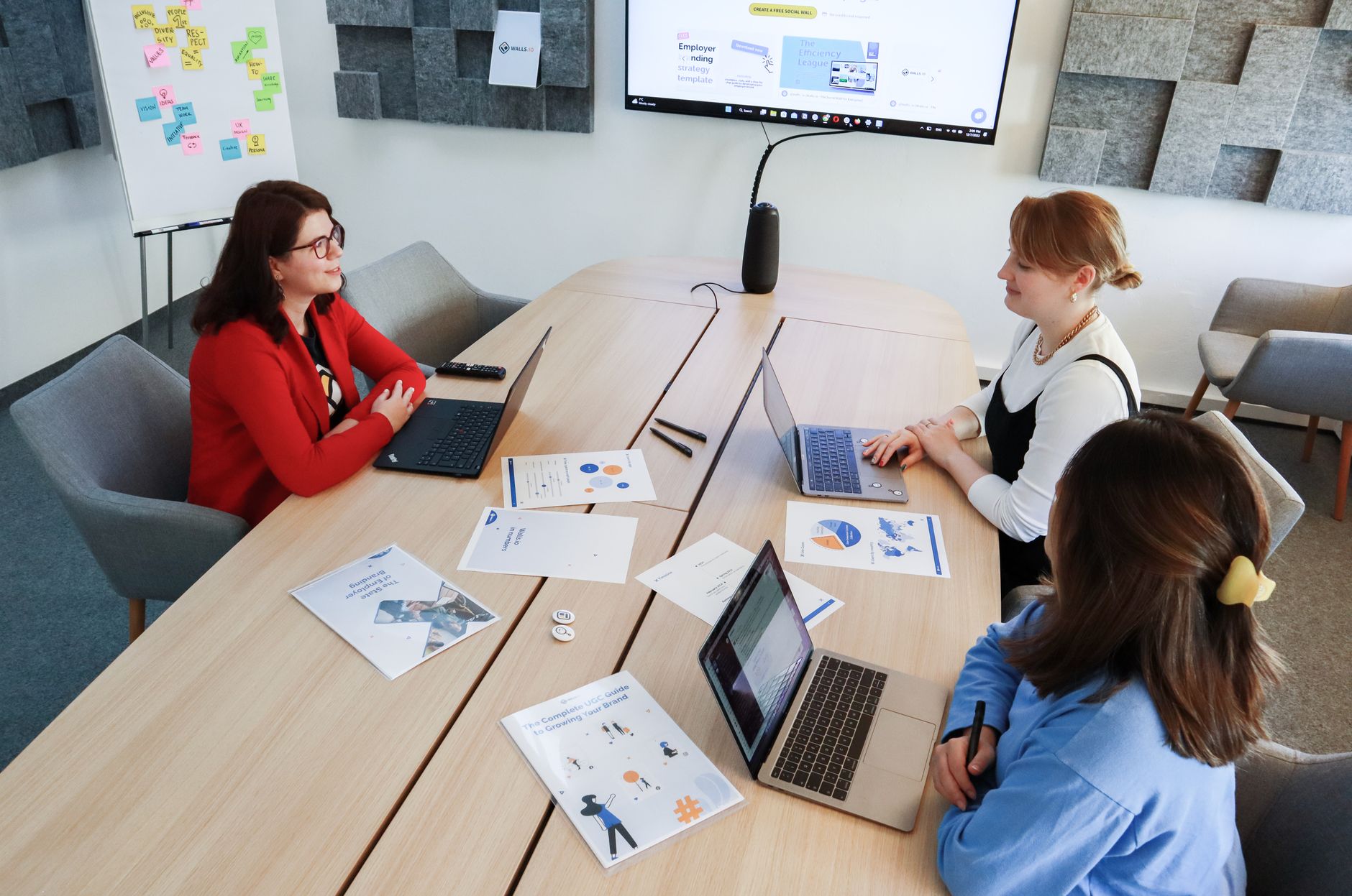 Diverse team collaborating in Oklahoma City office with task management software