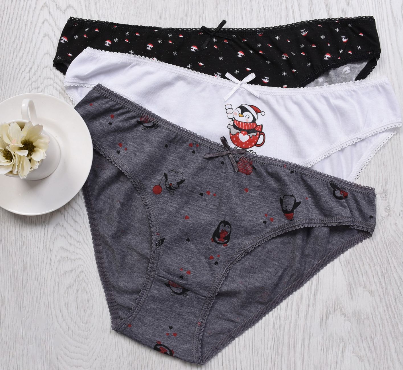 A stylish flat lay of colorful women's panties on a wooden surface, showcasing fun patterns.
