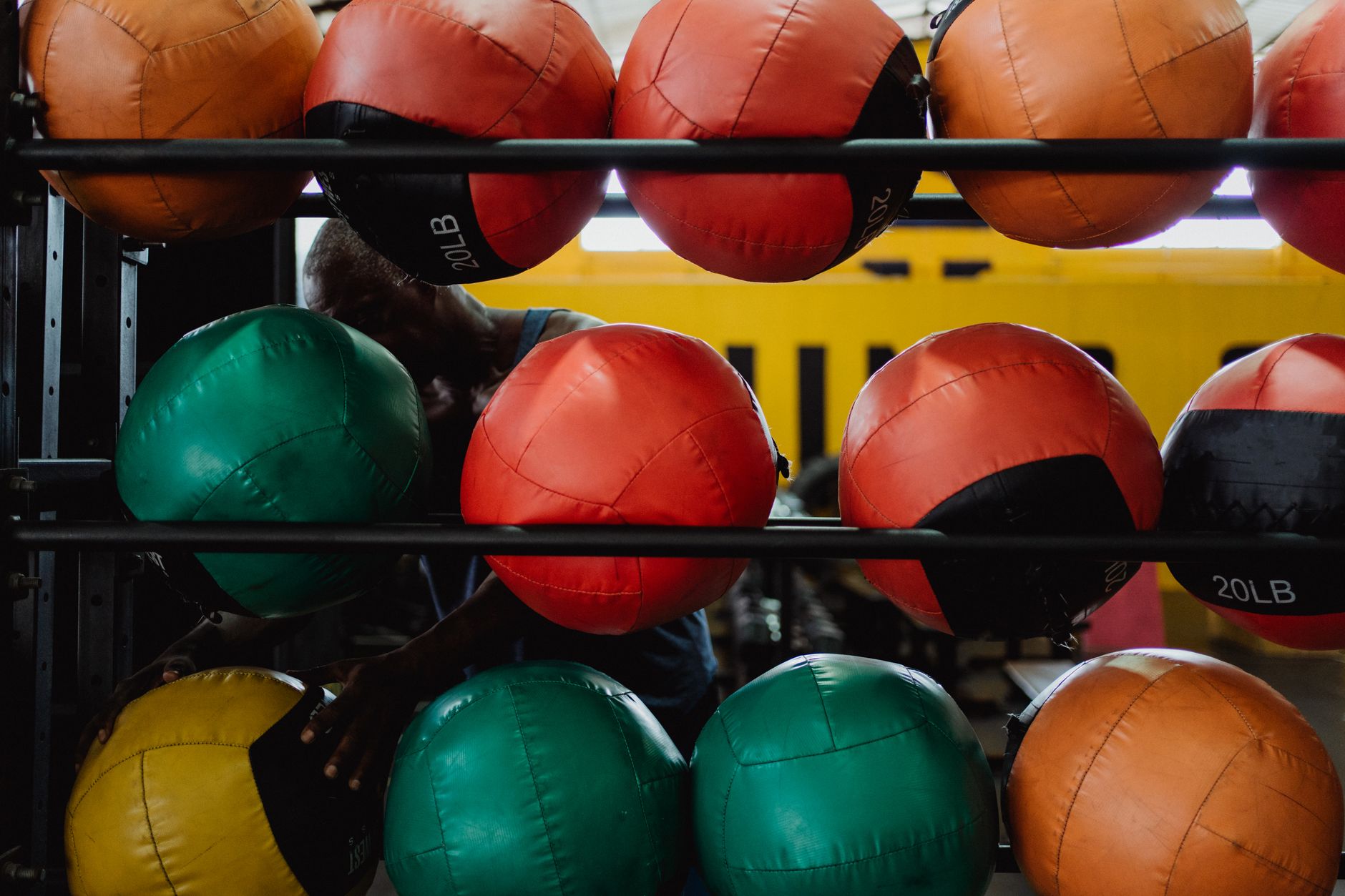 Colorful medicine balls displayed in a gym, ideal fitness and training visuals.