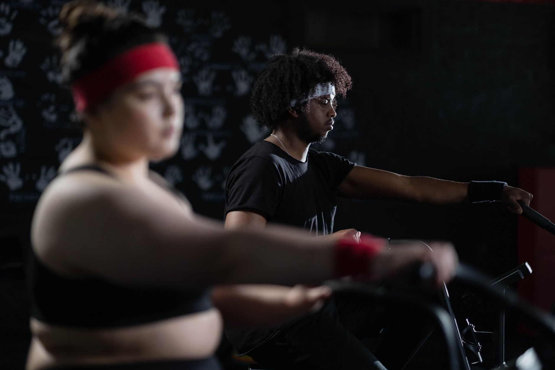 Dedicated gym-goers engaged in fitness training, emphasizing energy and focus.