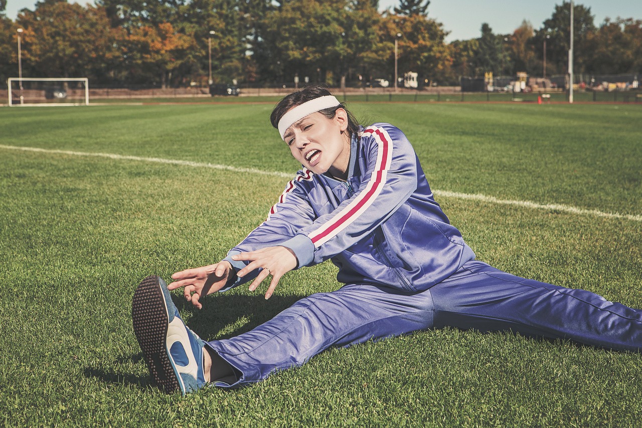 stretching, sports, woman, athlete, fitness, sport, healthy, exercise, workout, young, female, body, lifestyle, training, fit, health, stretch, people, active, girl, adult, person, sportswear, athletic, gym, exercising, nature, physical, sporty, white, pilates, leisure, tracksuit, track and field, shoes, headband, grass, field