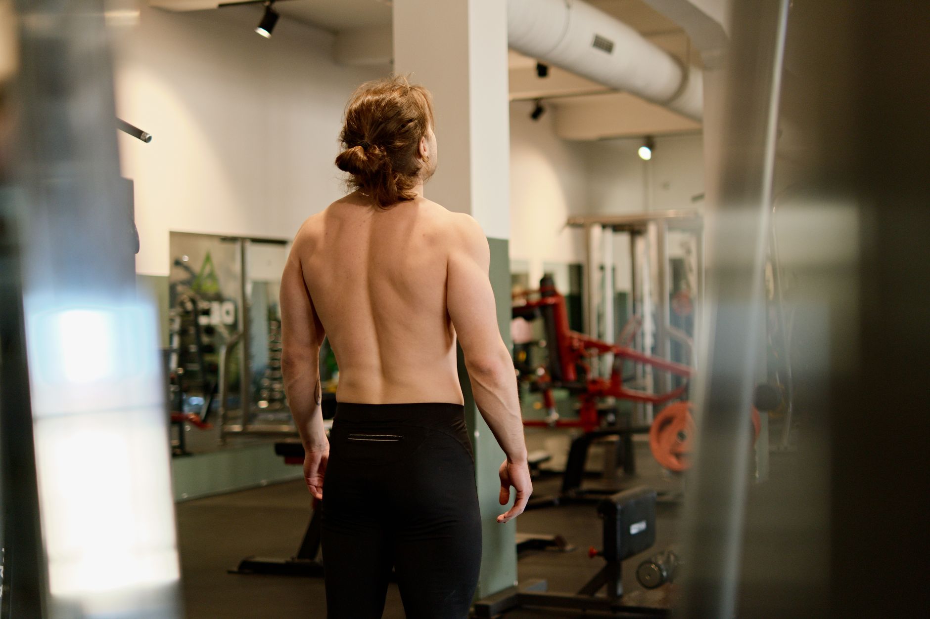 A fit man working out in a gym, highlighting exercise and fitness lifestyle.