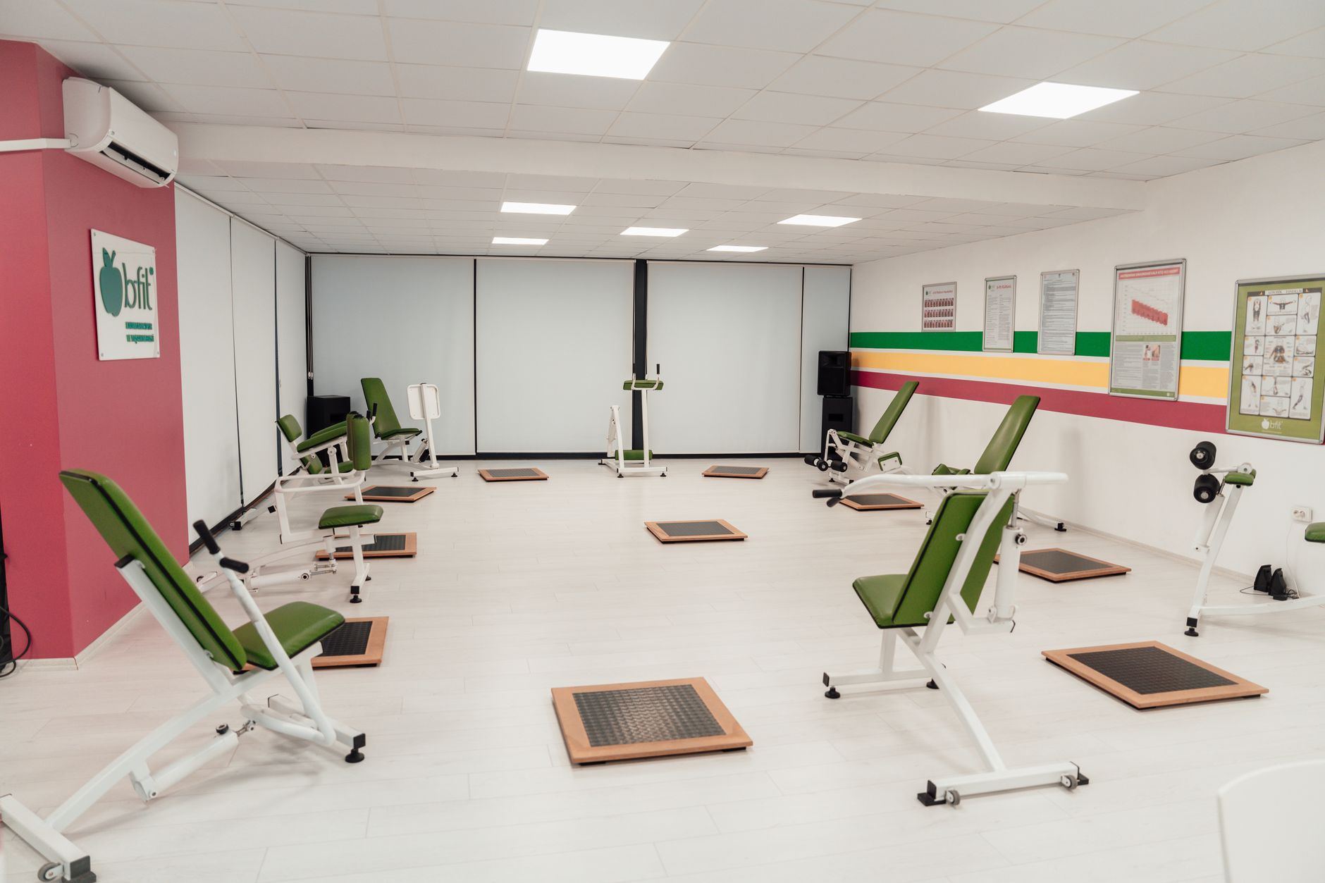 Bright and spacious gym interior featuring modern green exercise machines in Yalova.