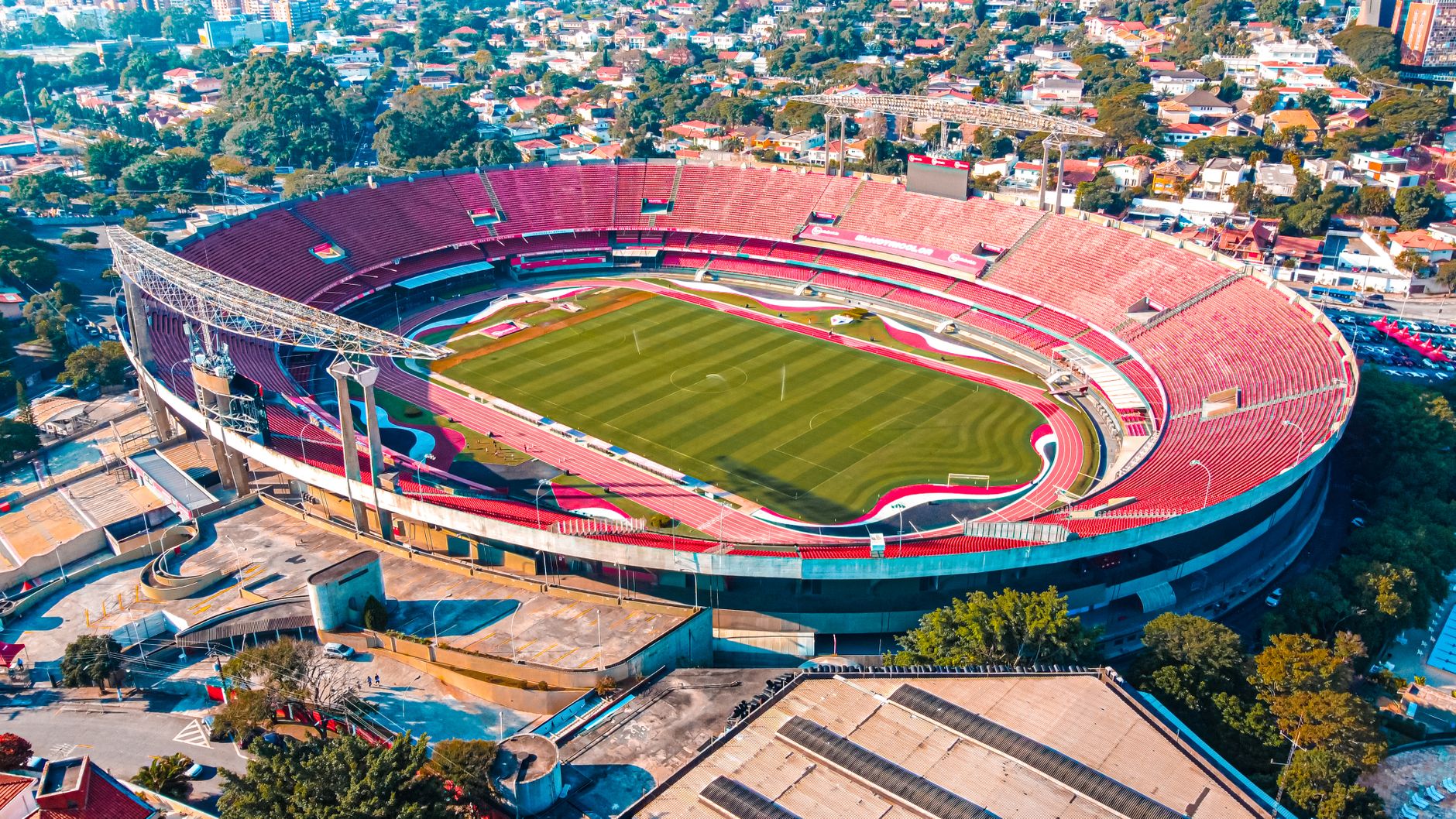 Aerial shot of the iconic Morumbi Stadium in São Paulo, Brazil, bathed in daylight.