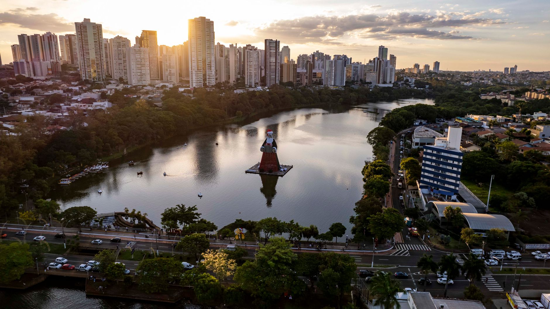 Captivating aerial view of Lago Igapó with city skyline in Londrina, Brazil during sunset.