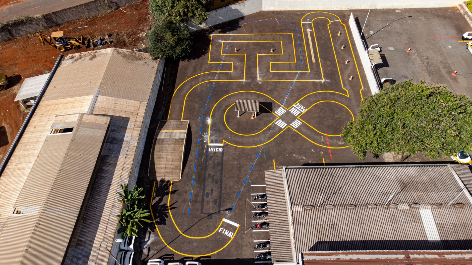 Aerial shot of a parking lot with traffic training markings in Londrina, Brazil.