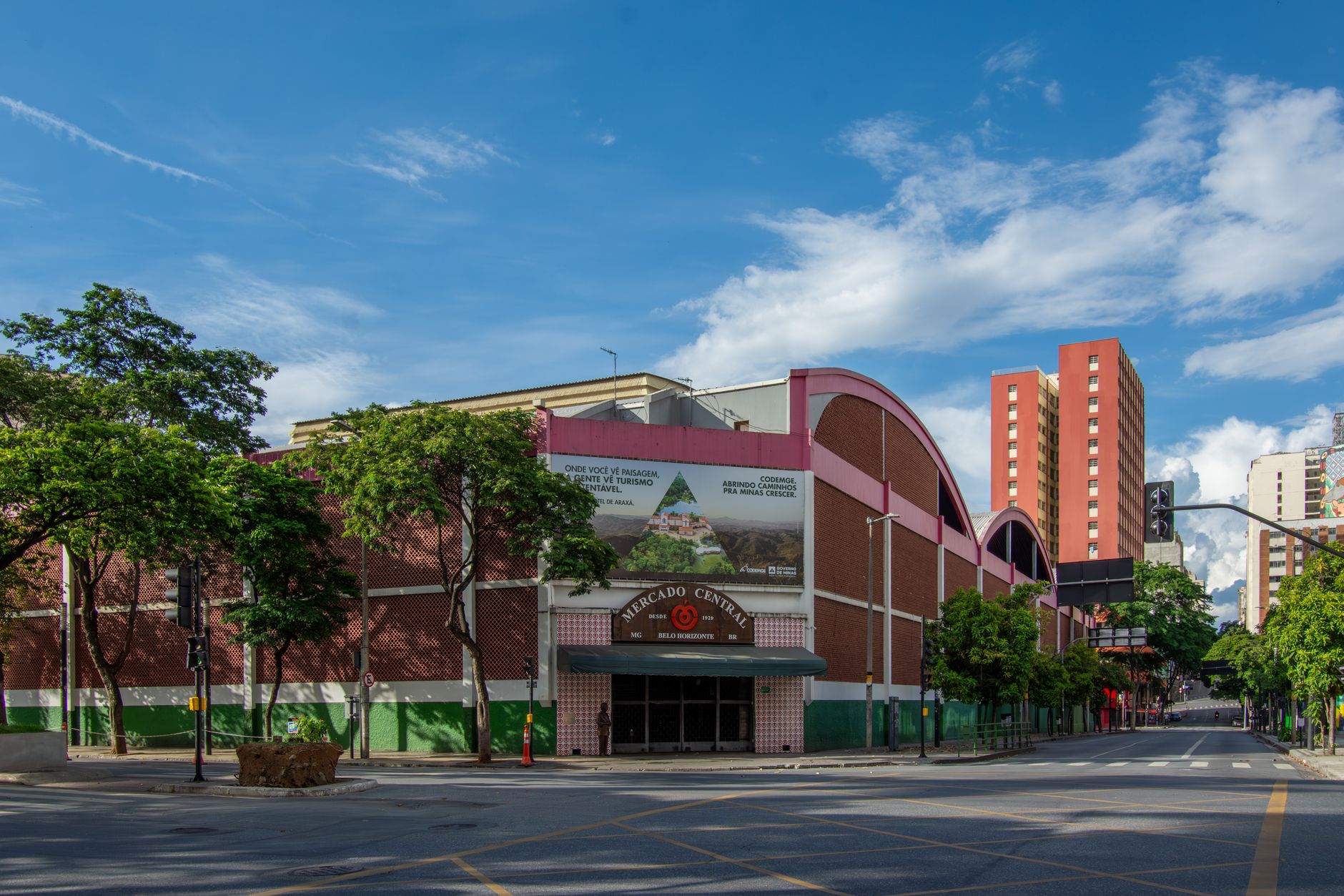 Exterior view of Mercado Central in Belo Horizonte, Brazil under a bright blue sky.