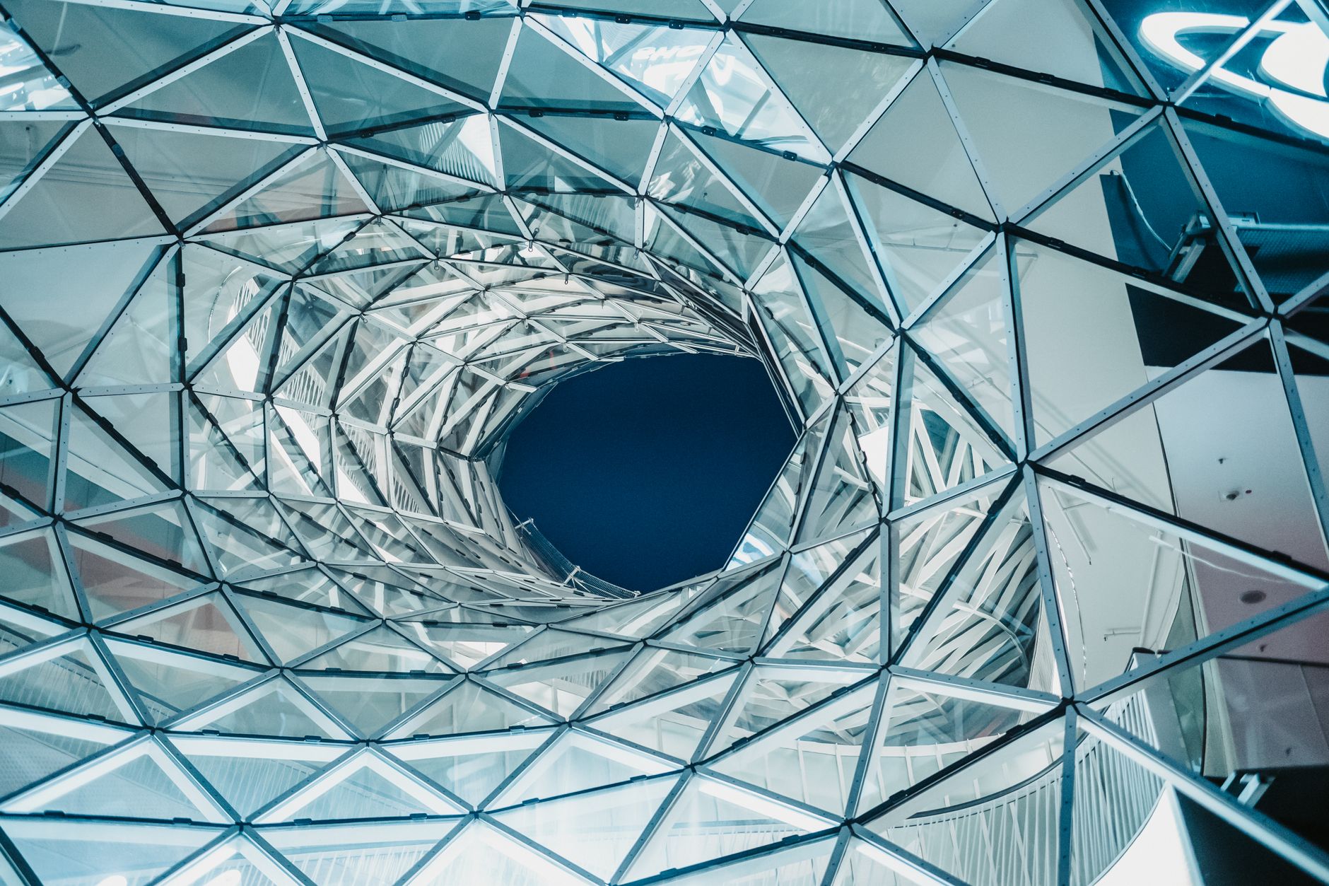 Dramatic view of MyZeil shopping mall's geometric ceiling, Frankfurt, Germany.