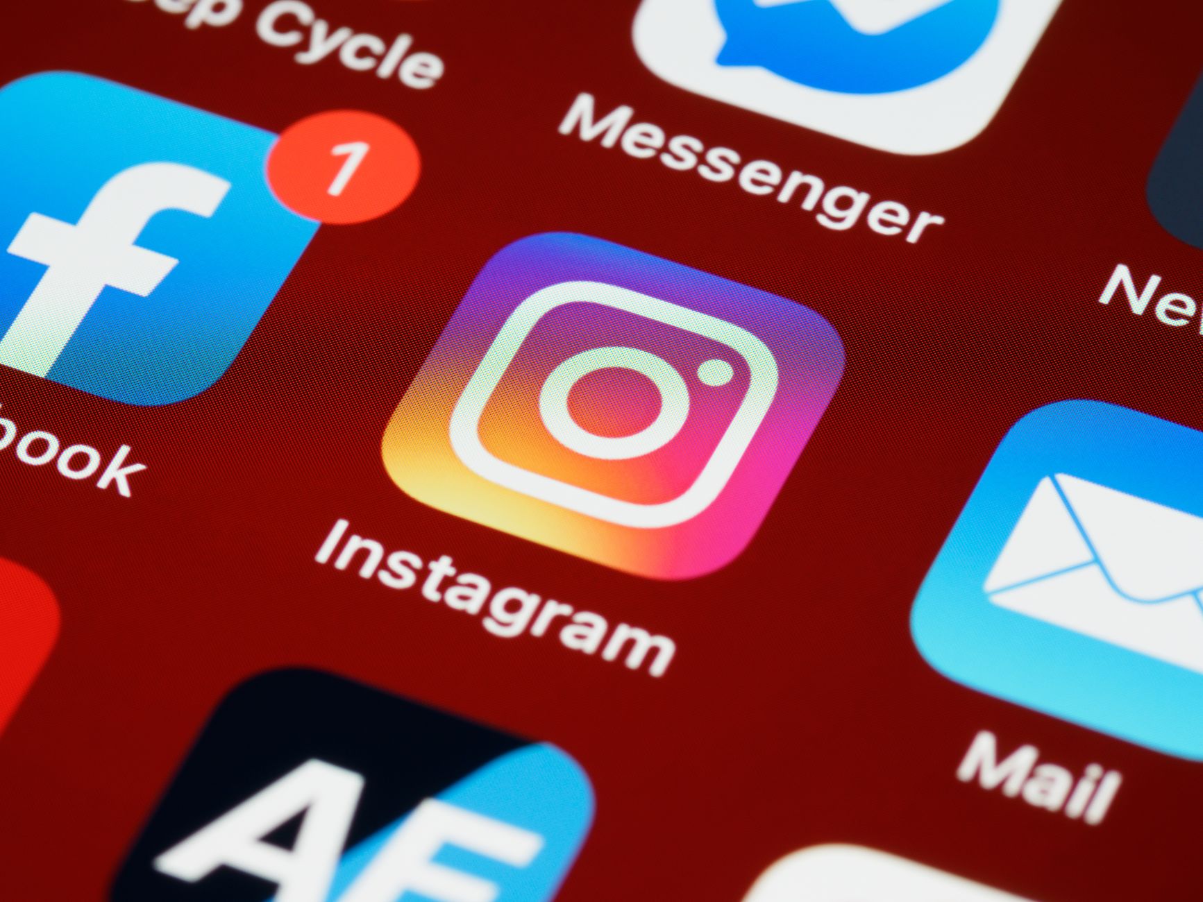 Vibrant close-up of popular social media app icons on a smartphone screen.