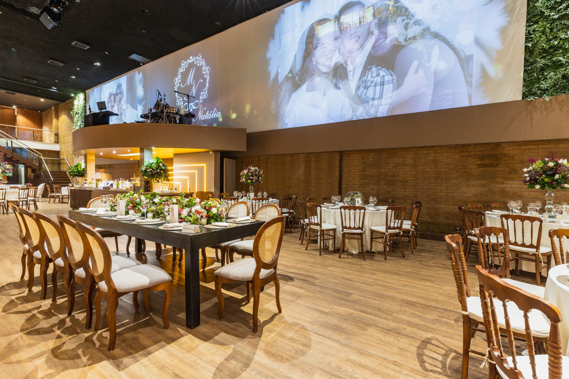 Charming wedding hall with elegant decor, floral arrangements, and sophisticated table settings.