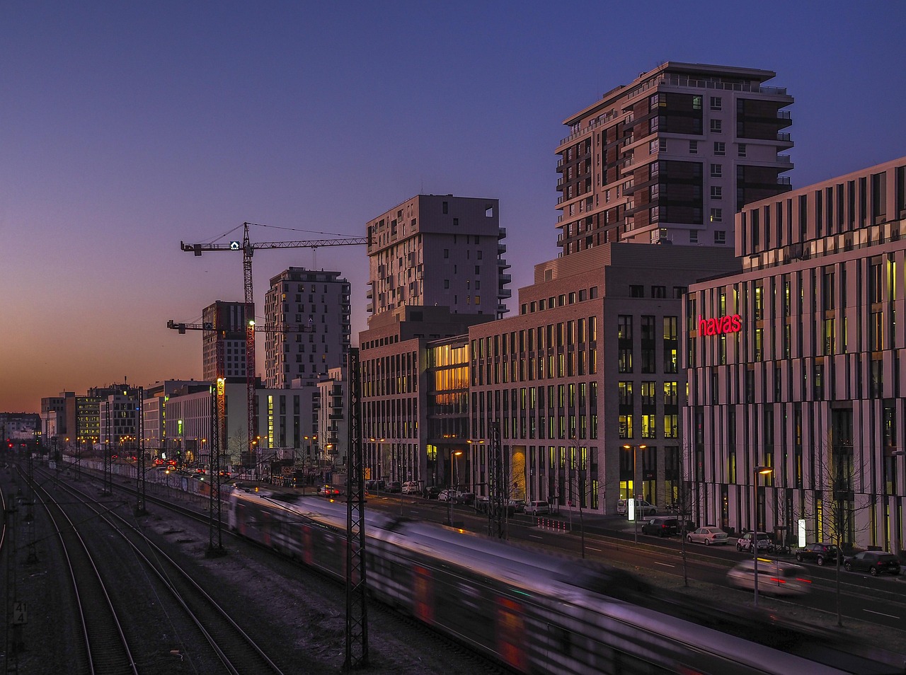 architecture, in the morning, sunrise, city, building, skyline, heaven, nature, cityscape, light, downtown, skyscraper, dawn, construction cranes, train, rail, tracks, road, metropolis, traffic