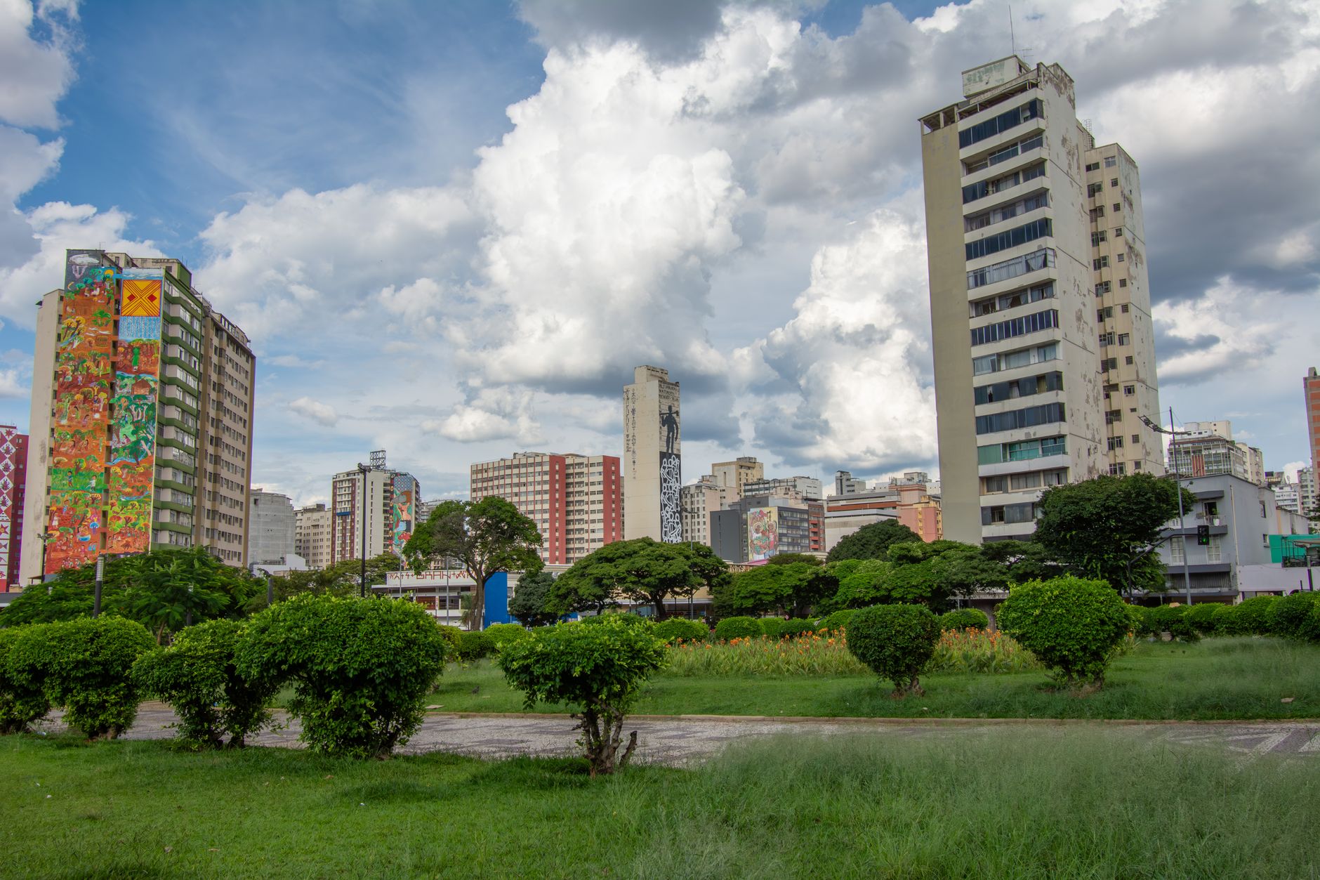 Skyline of Belo Horizonte featuring modern high-rise buildings under a dramatic sky.