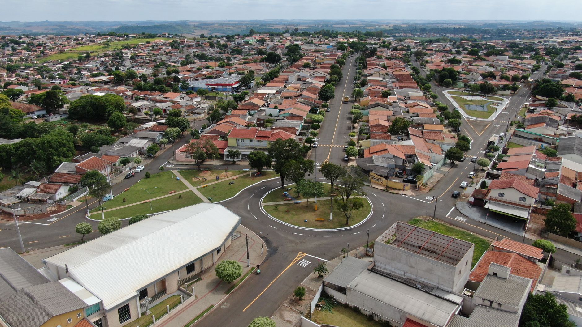 Aerial shot showcasing the suburban residential layout in Jatobá, Paraná, Brazil, with a distinctive roundabout.