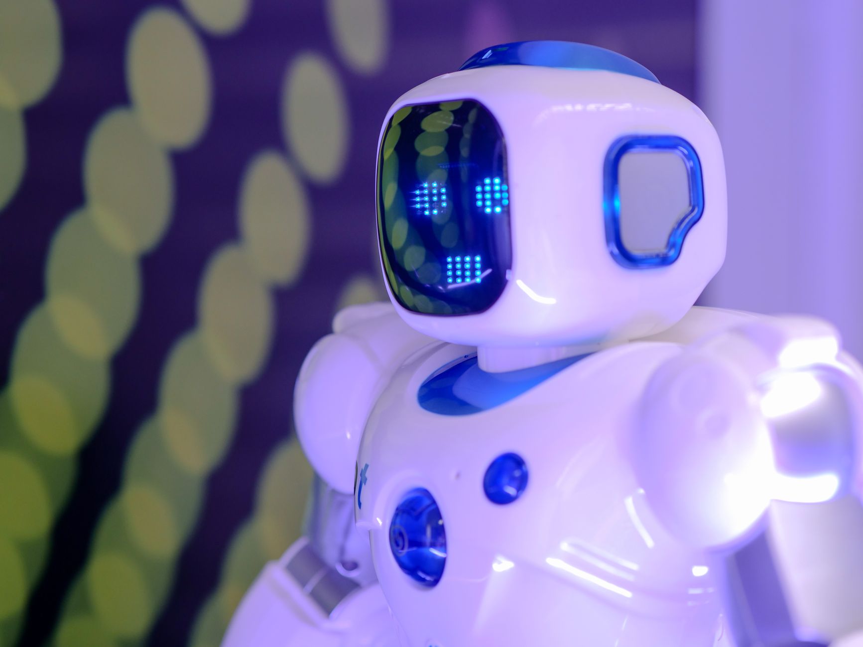 Modern toy robot with LED facial display, showcasing advanced technology and innovation.