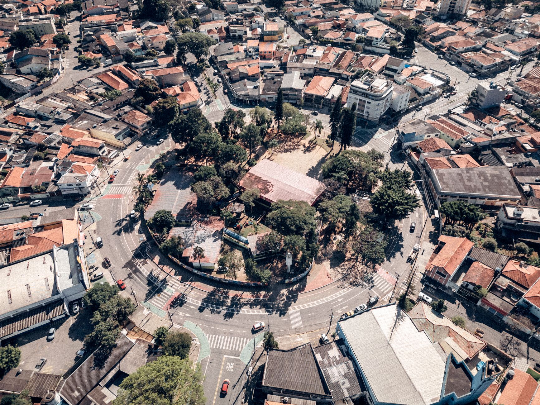 Aerial view of the circular park surrounded by urban buildings in Jardim Vila Galvao, Sao Paulo.