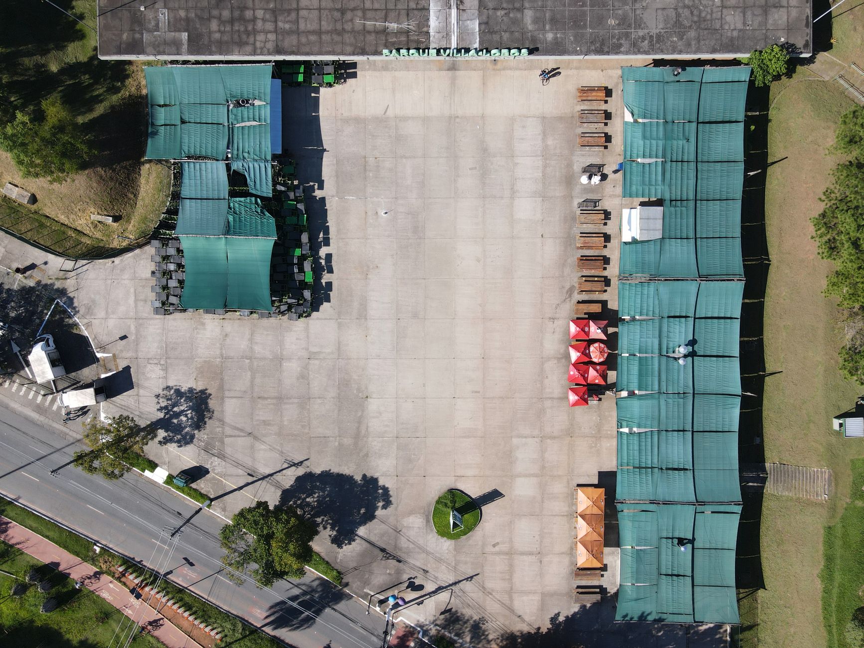 Drone shot of market stalls and pavement in São Paulo, Brazil.